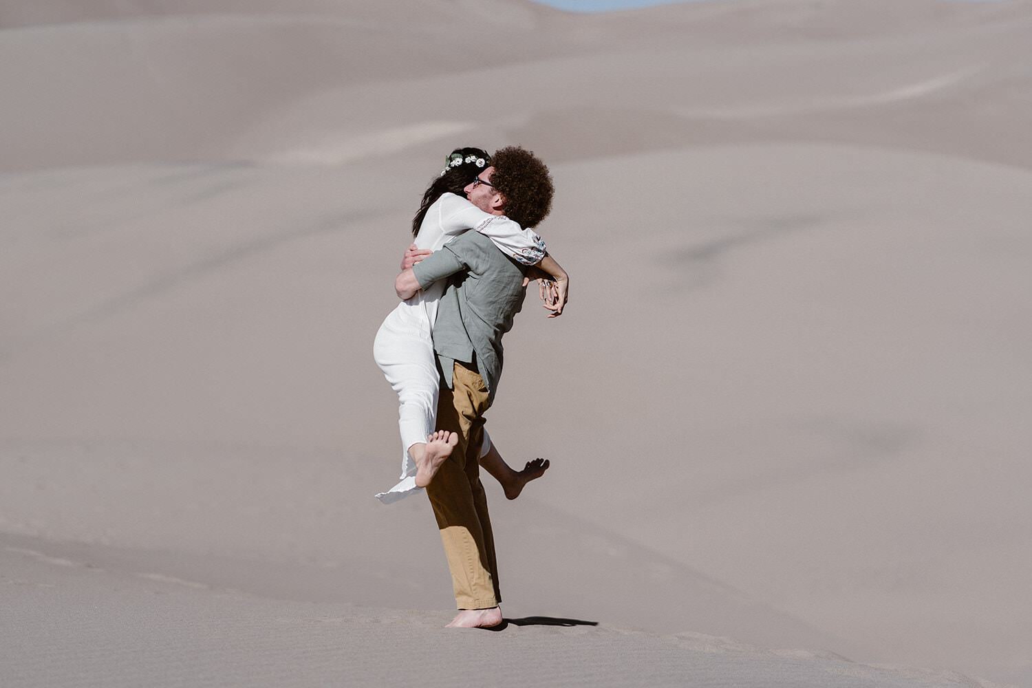 Bride and Groom hugging at Colorado Great Sand Dunes Elopement