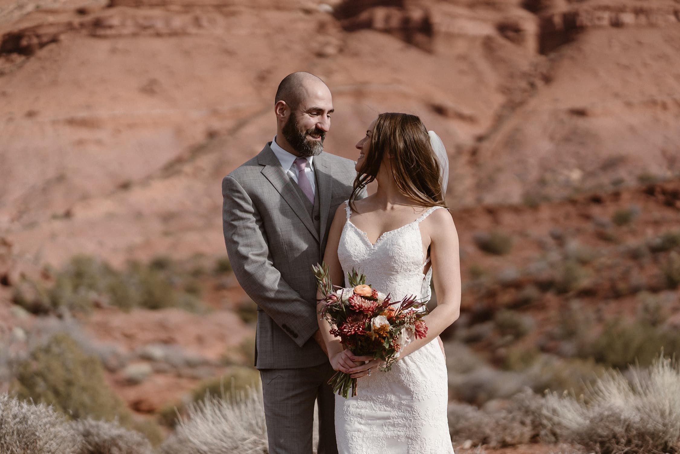 Bride and Groom Laughing at Moab Elopement