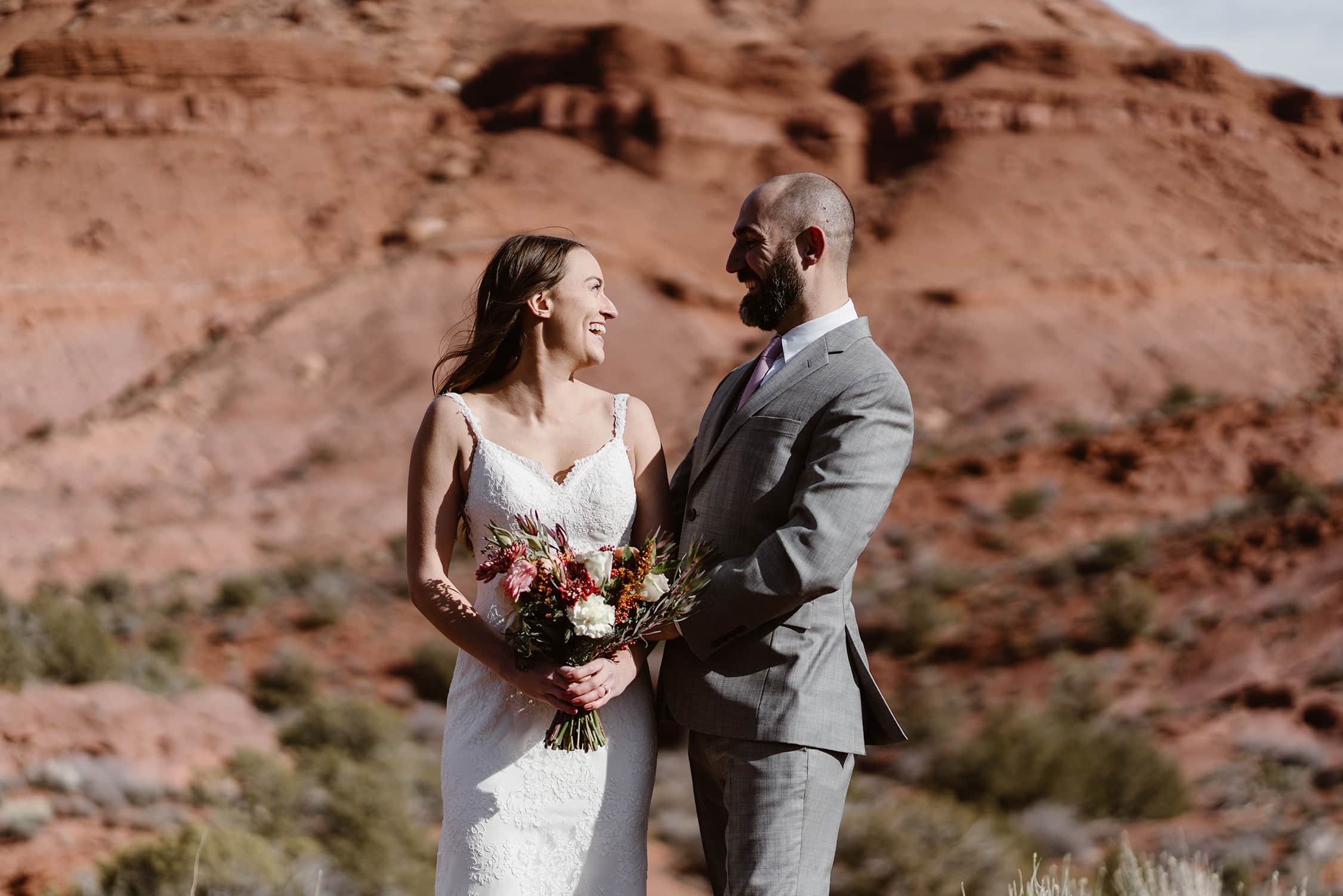 Bride and Groom Laughing at Moab Elopement