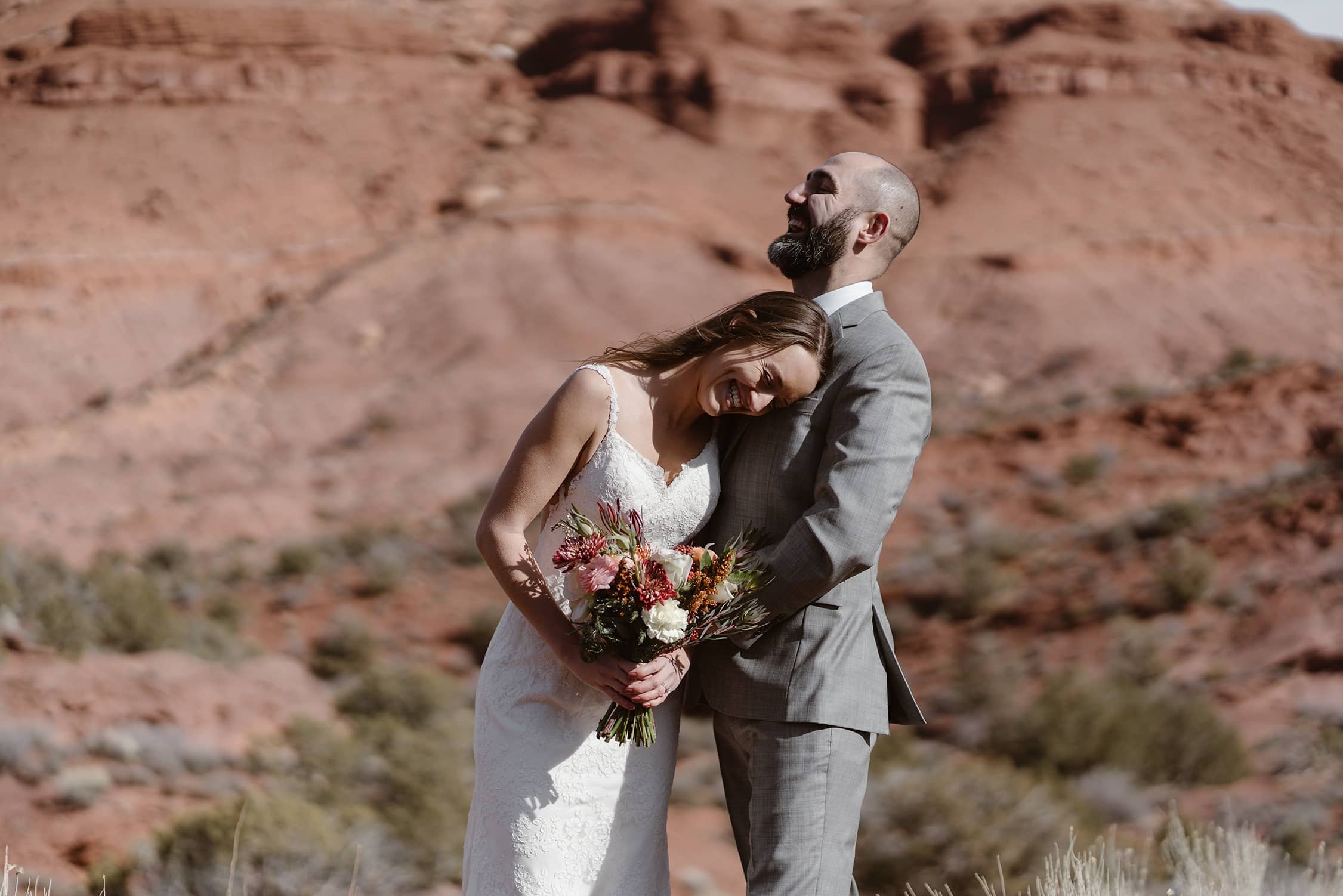 Bride and Groom Laughing at Moab Elopement