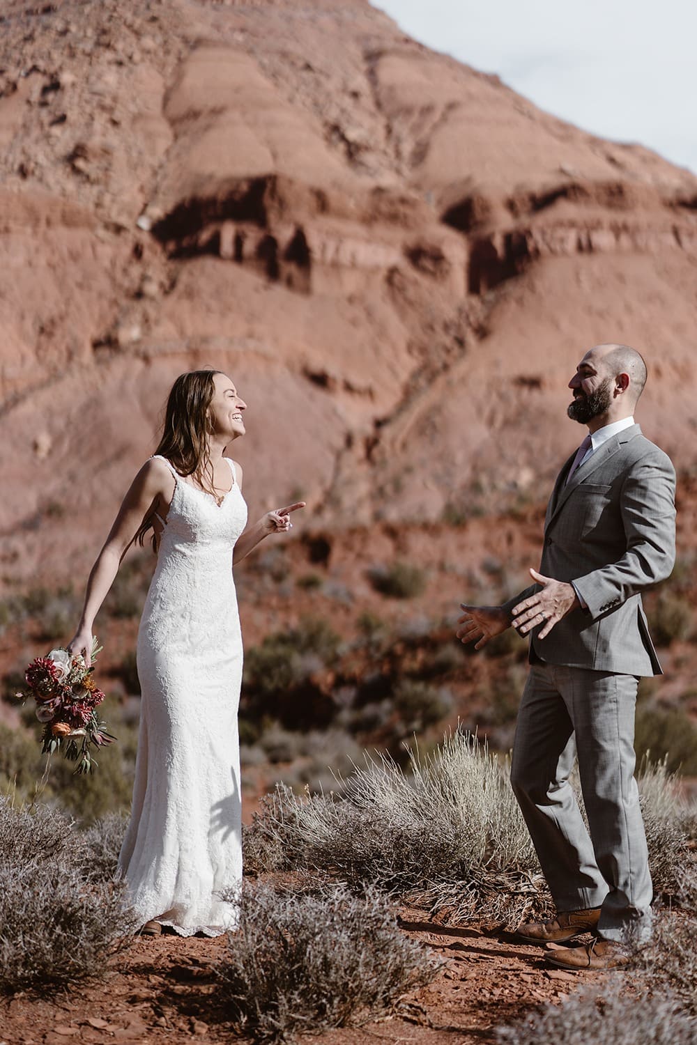 Bride and Groom Laughing at Moab Elopement