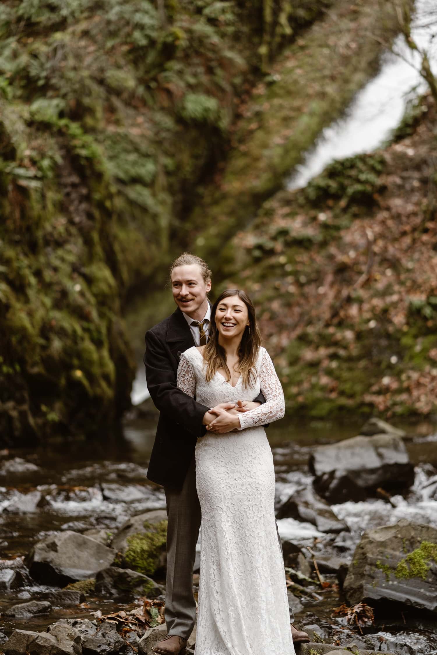 Bride and Groom Hugging Oregon Adventurous Waterfall elopement