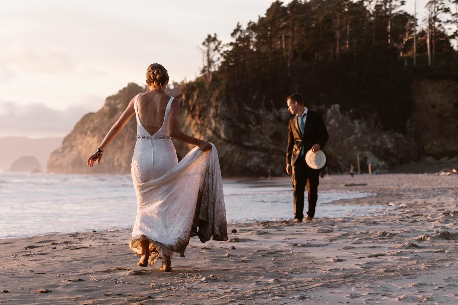 Bride and Groom playing frisbee at Hug Point & Cannon Beach Elopement