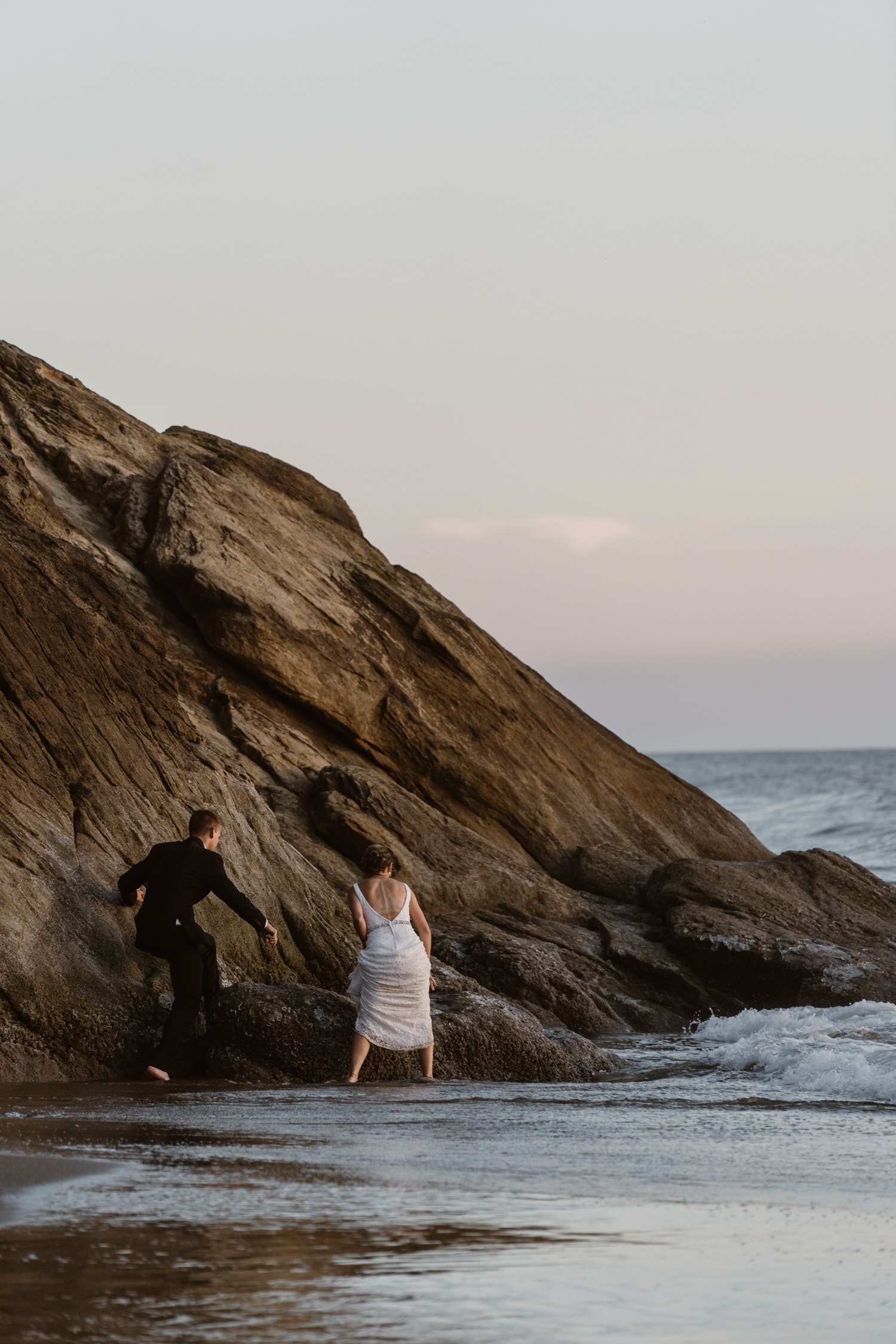 Bride and Groom near ocean at Hug Point & Cannon Beach Elopement