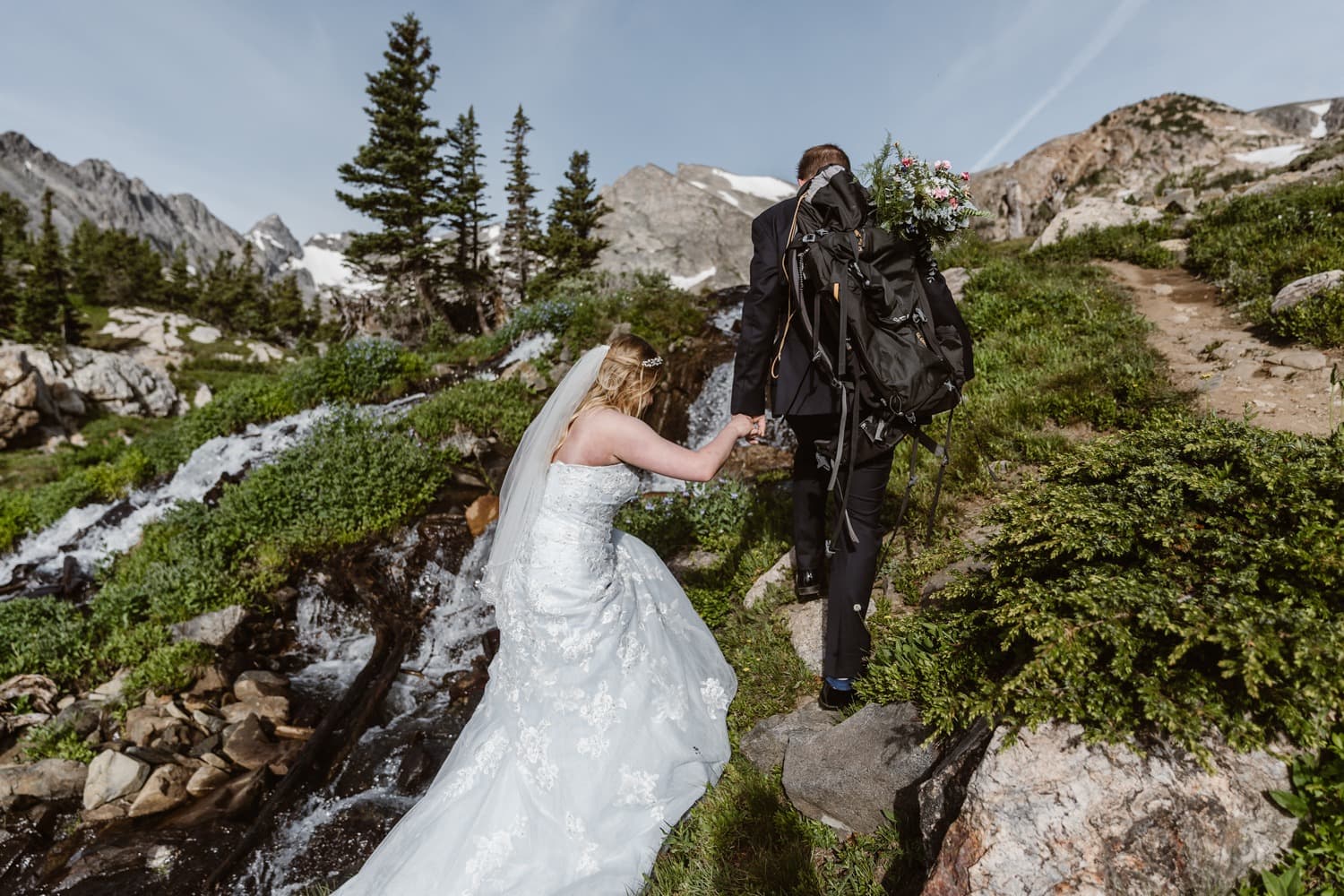 Bride and Groom Hiking at Colorado Adventure Elopement