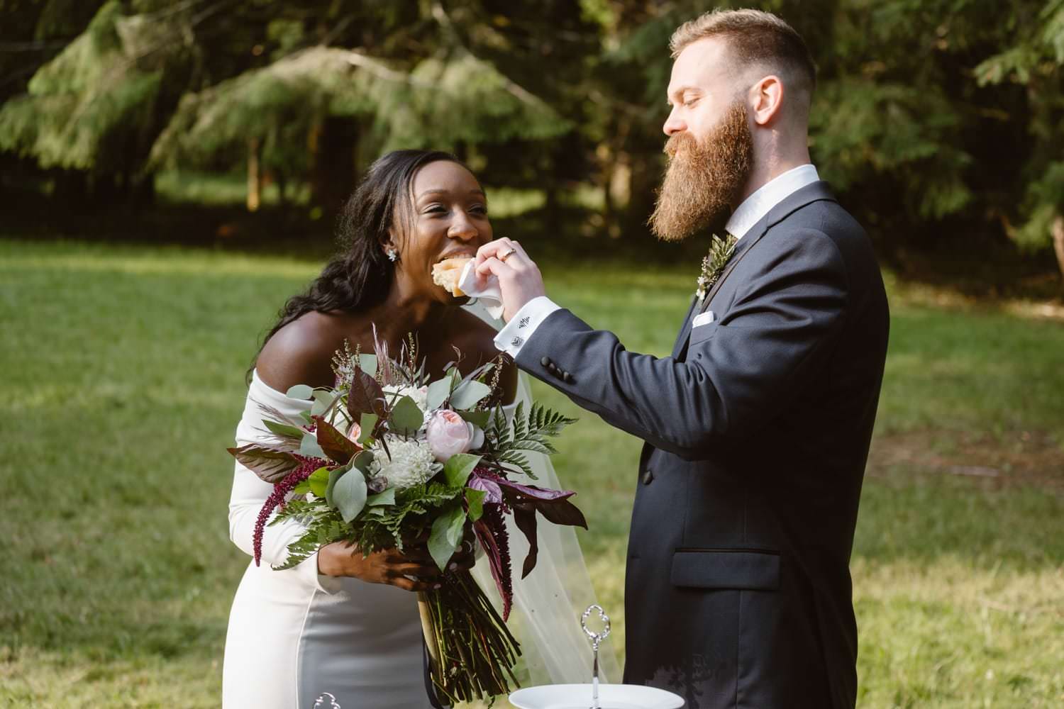 Bride and Groom Eating Donuts at Olympic National Park Elopement Ceremony