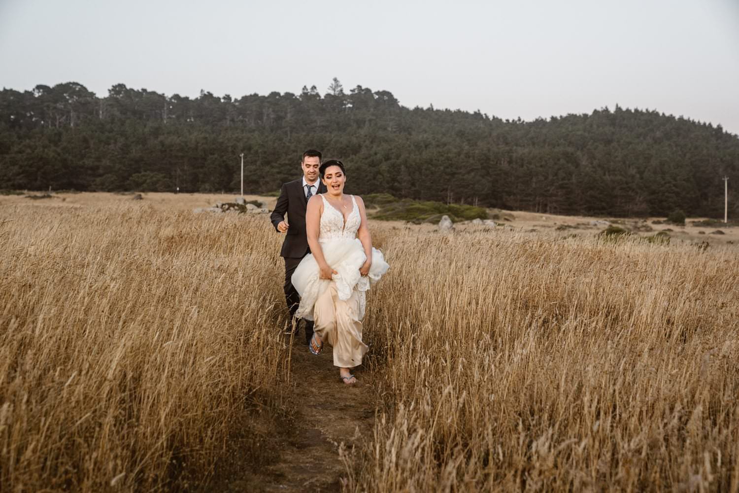 Bride running at Big Sur Elopement