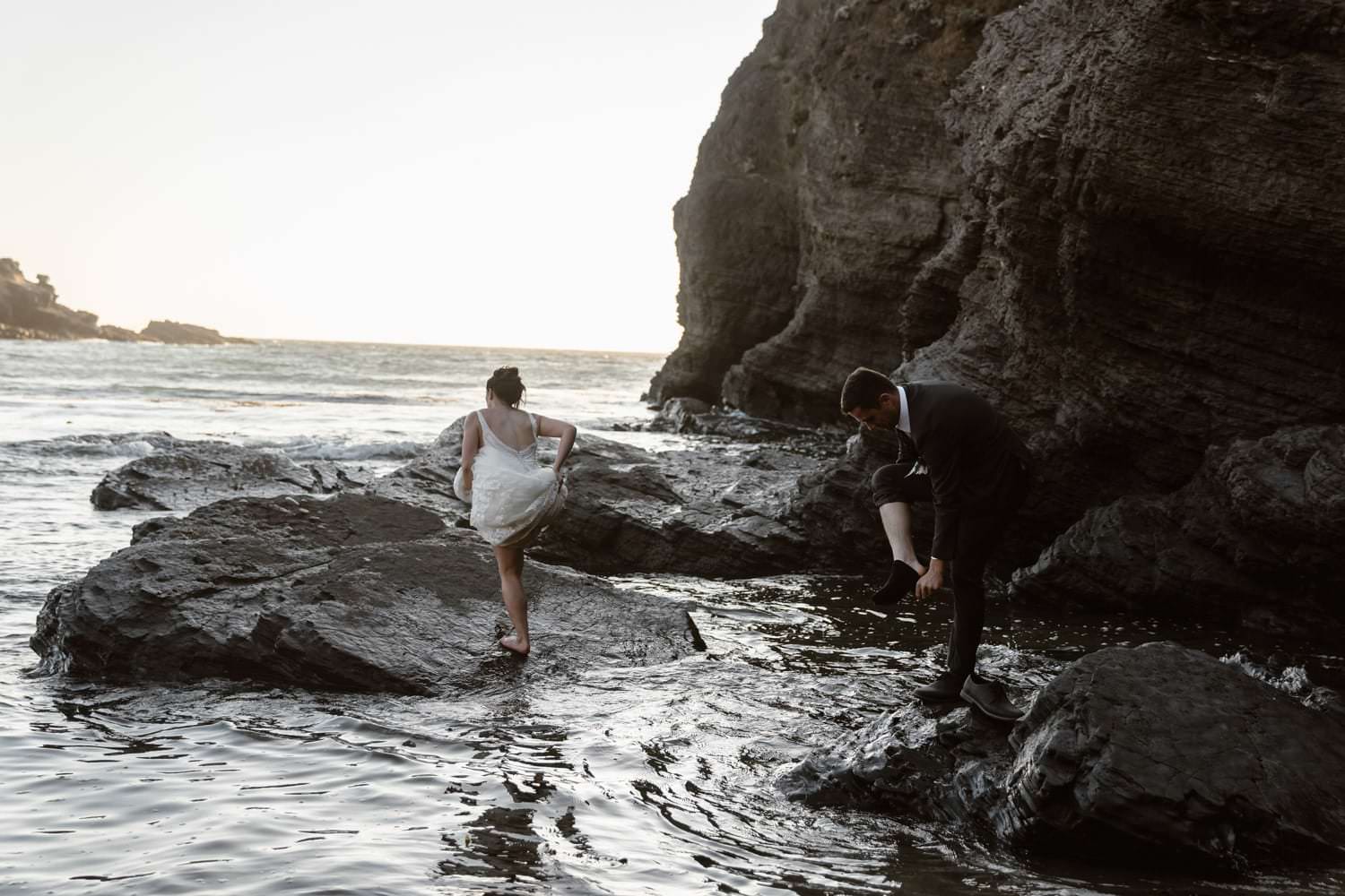 Bride and Groom in the tide pools at Big Sur Elopement