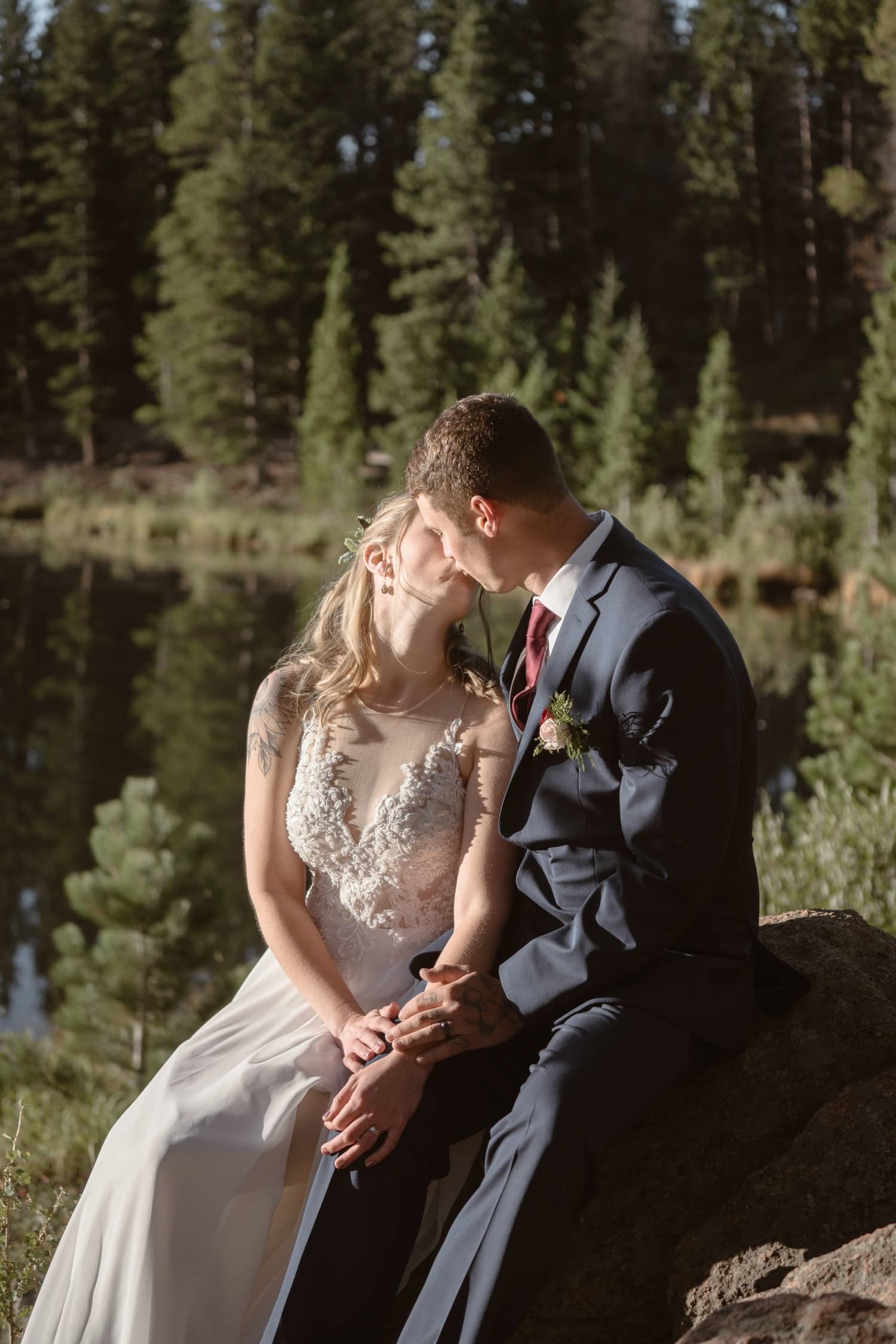 Bride and Groom kissing at Lily Lake Rocky Mountain National Park Elopement