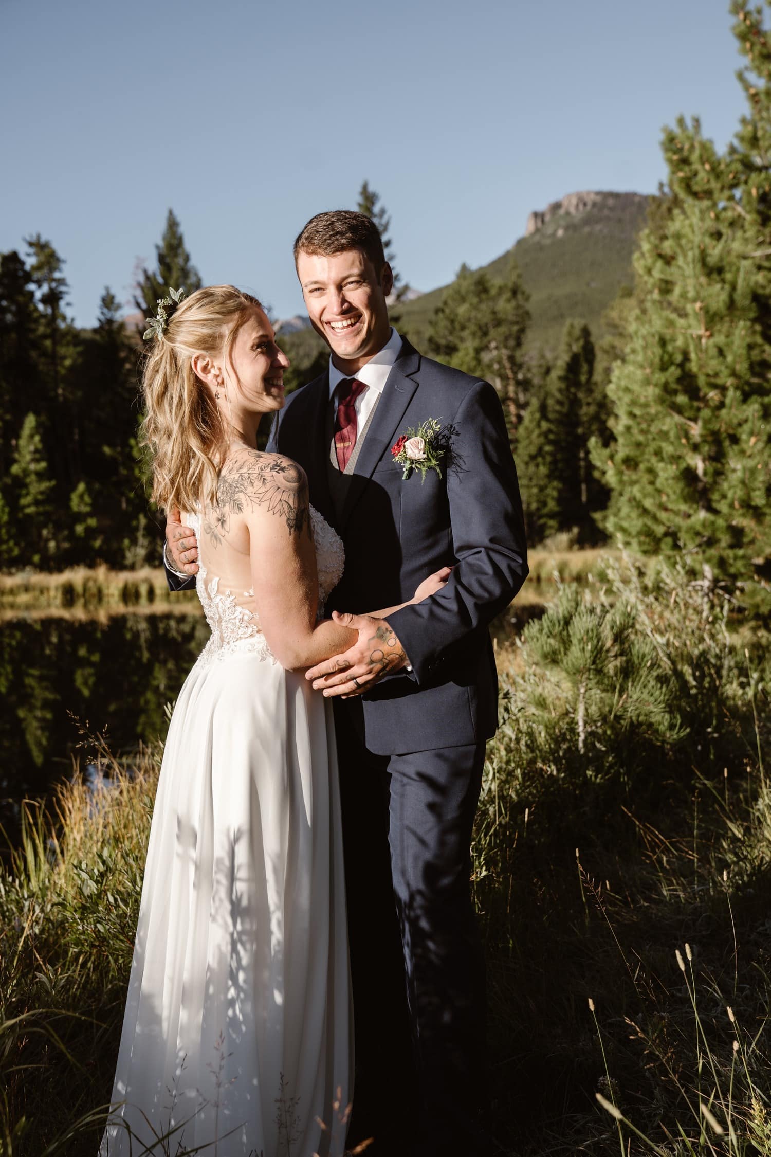 Bride and Groom laughing at Lily Lake Rocky Mountain National Park Elopement