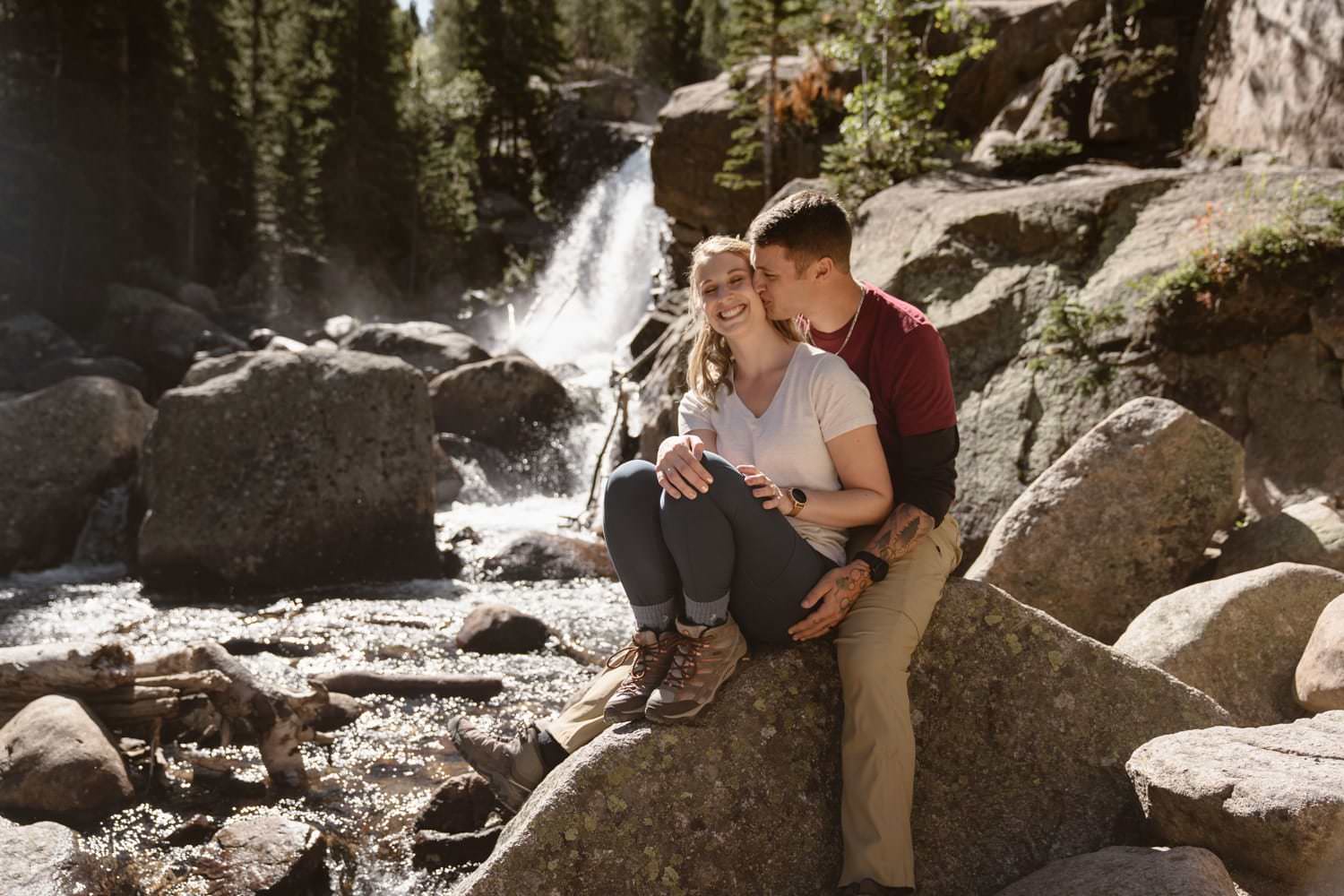 Bride and Groom at waterfall at Rocky Mountain National Park Hiking Elopement