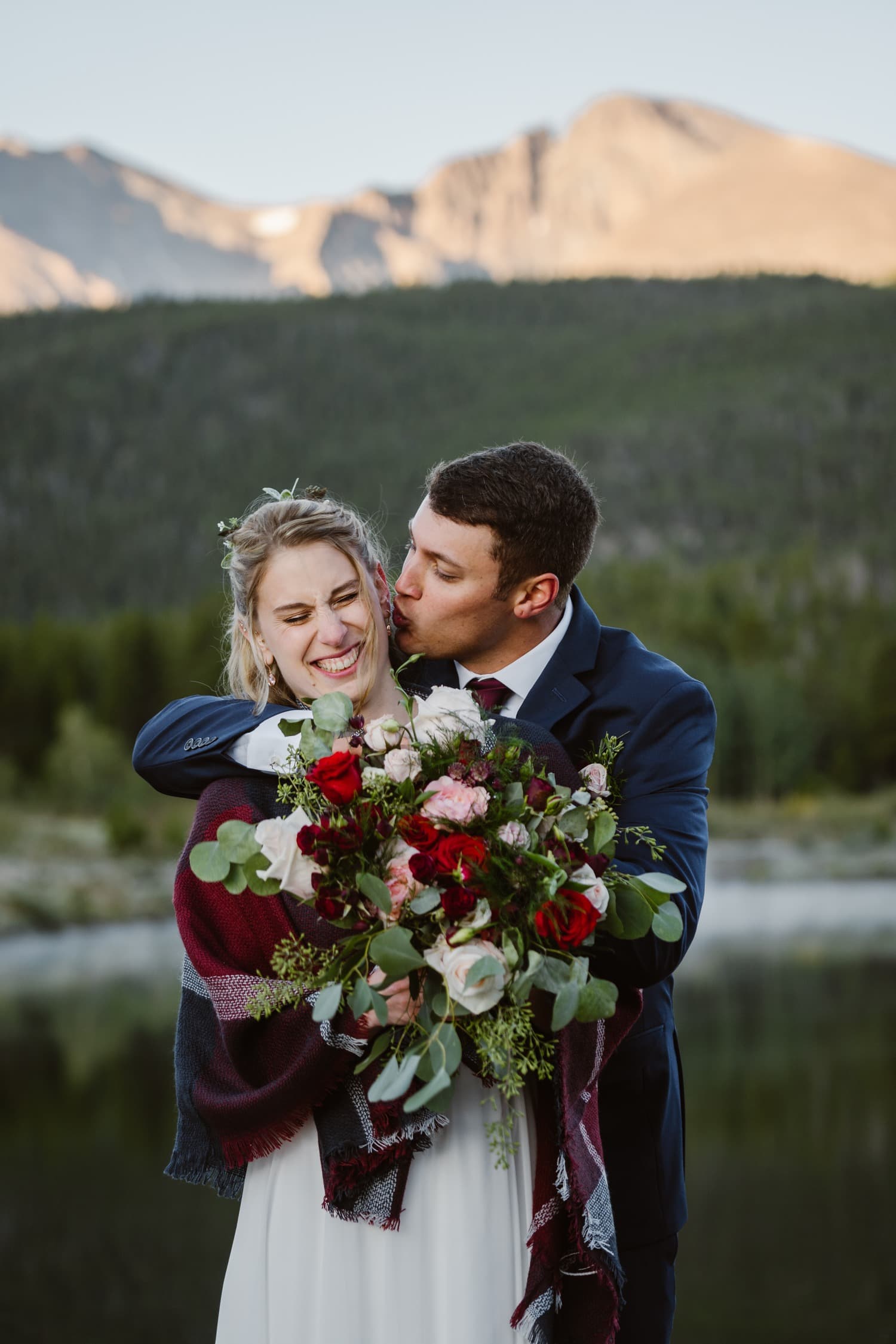 Kisses at Lily Lake Rocky Mountain National Park Elopement