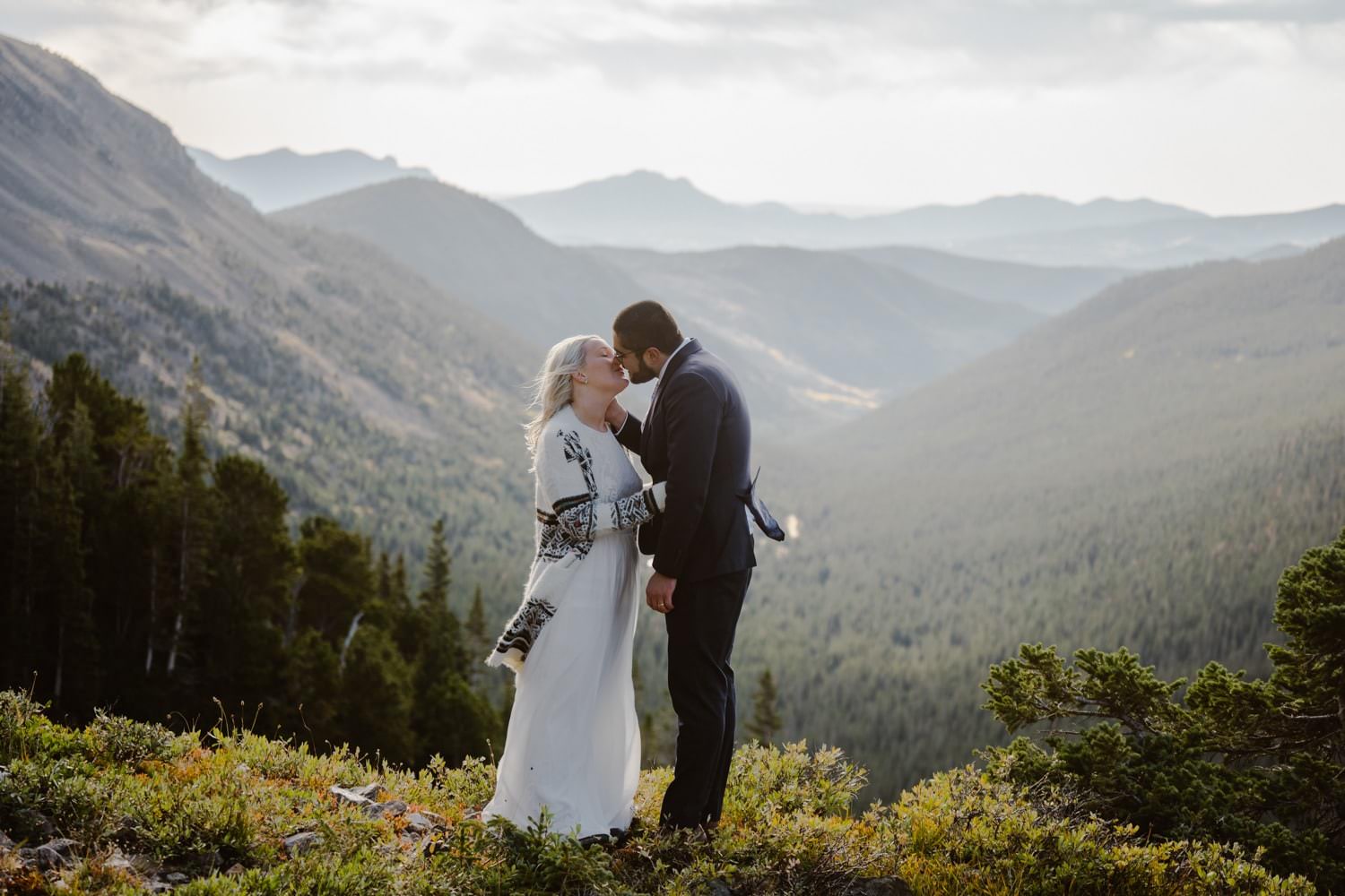 Bride and Groom Kissing Colorado Hiking Elopement