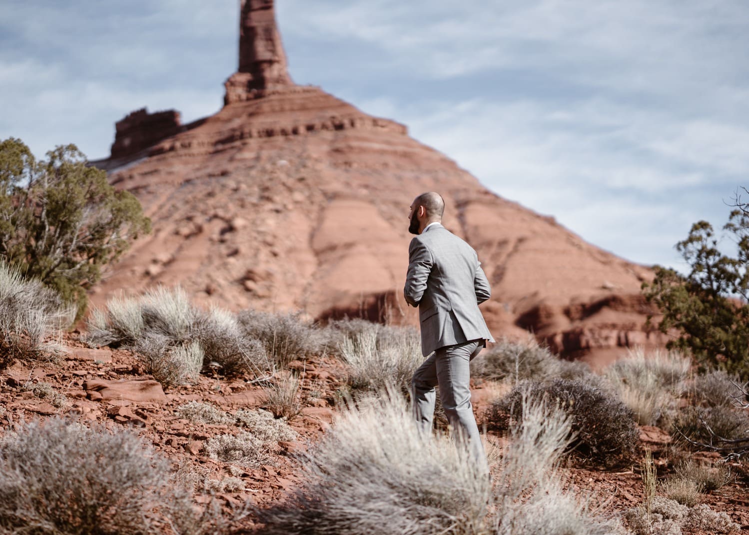 Groom Hiking During Moab Elopement