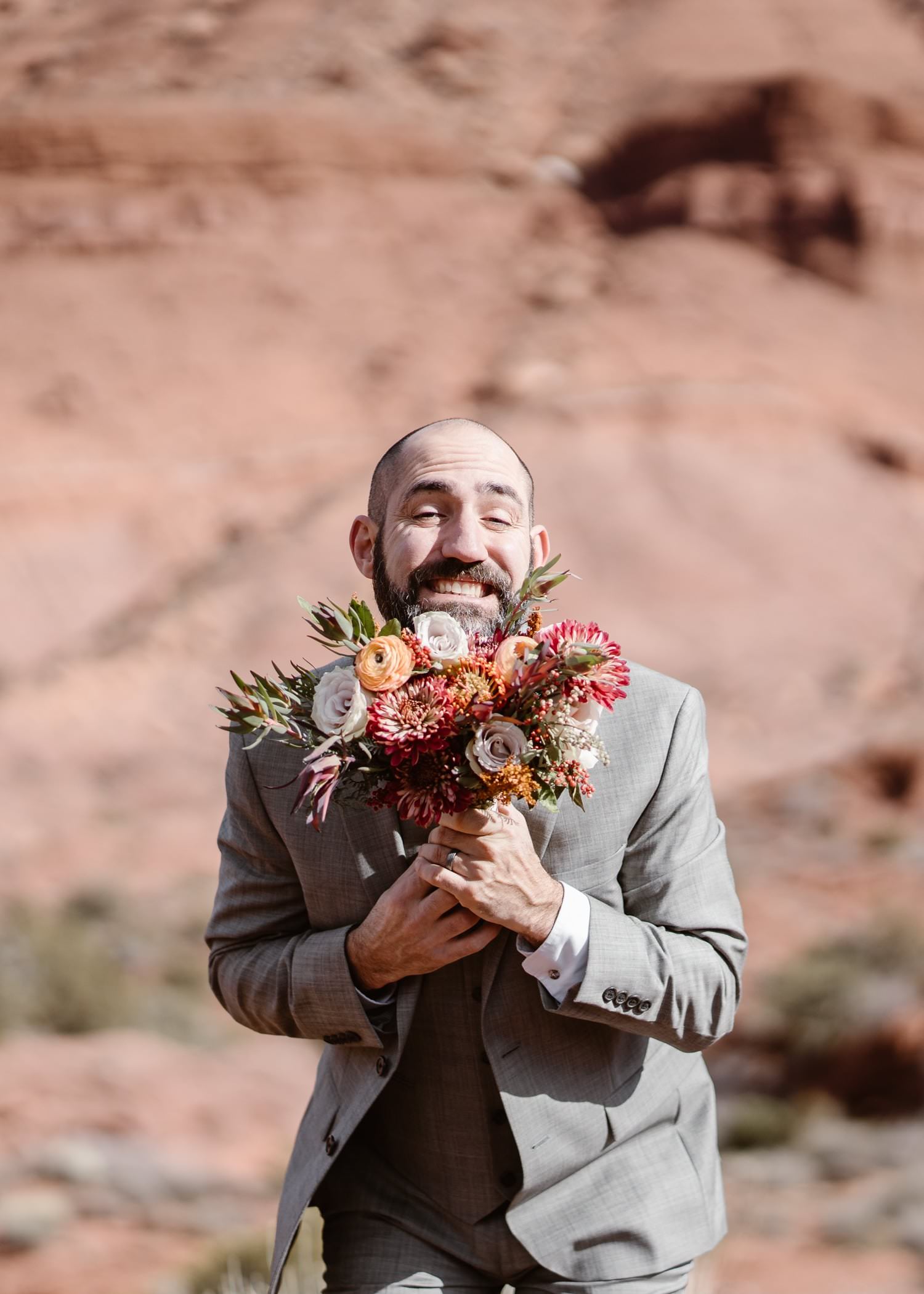 Groom With Flowers at Moab Elopement