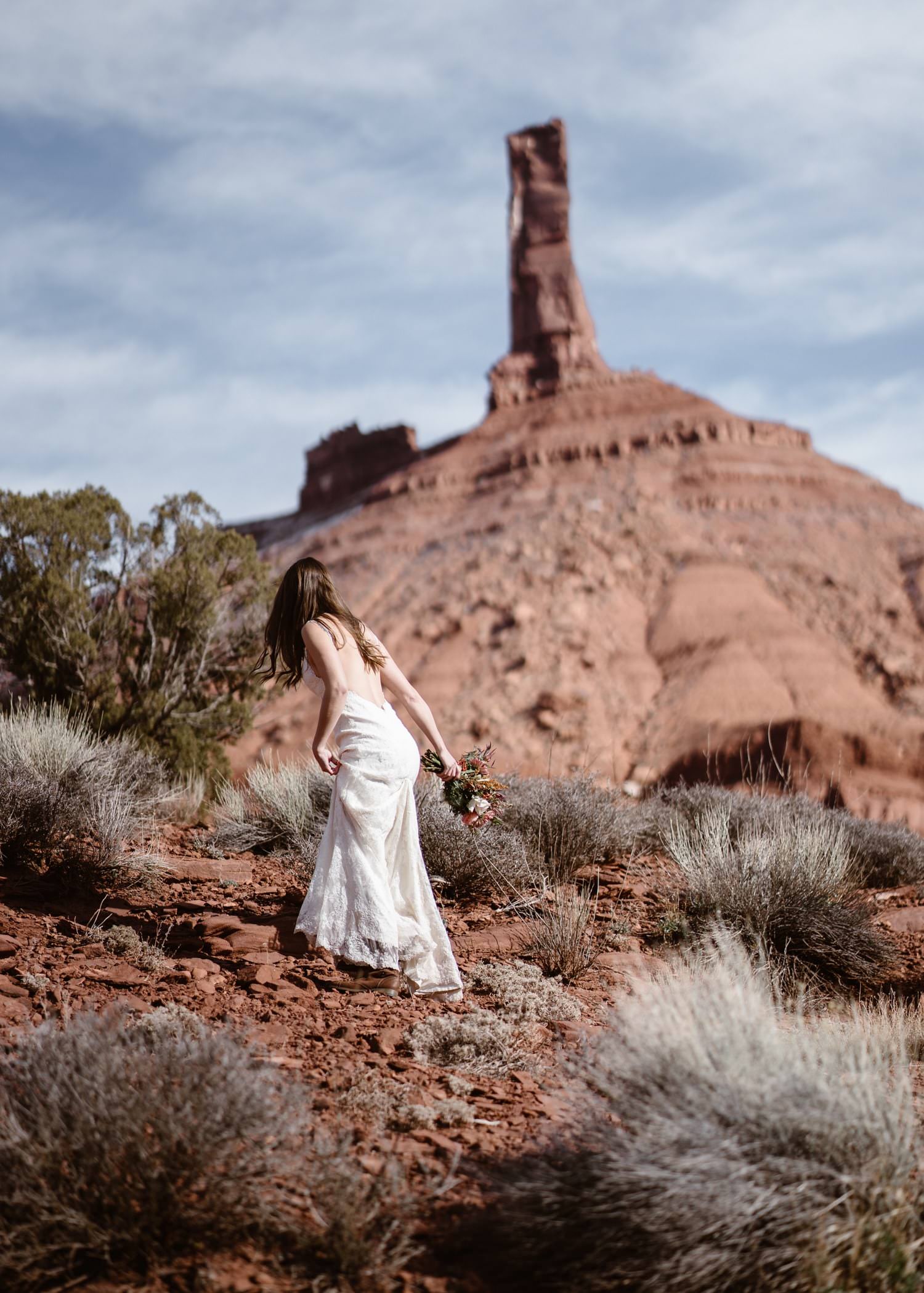 Bride Hiking During Moab Elopement