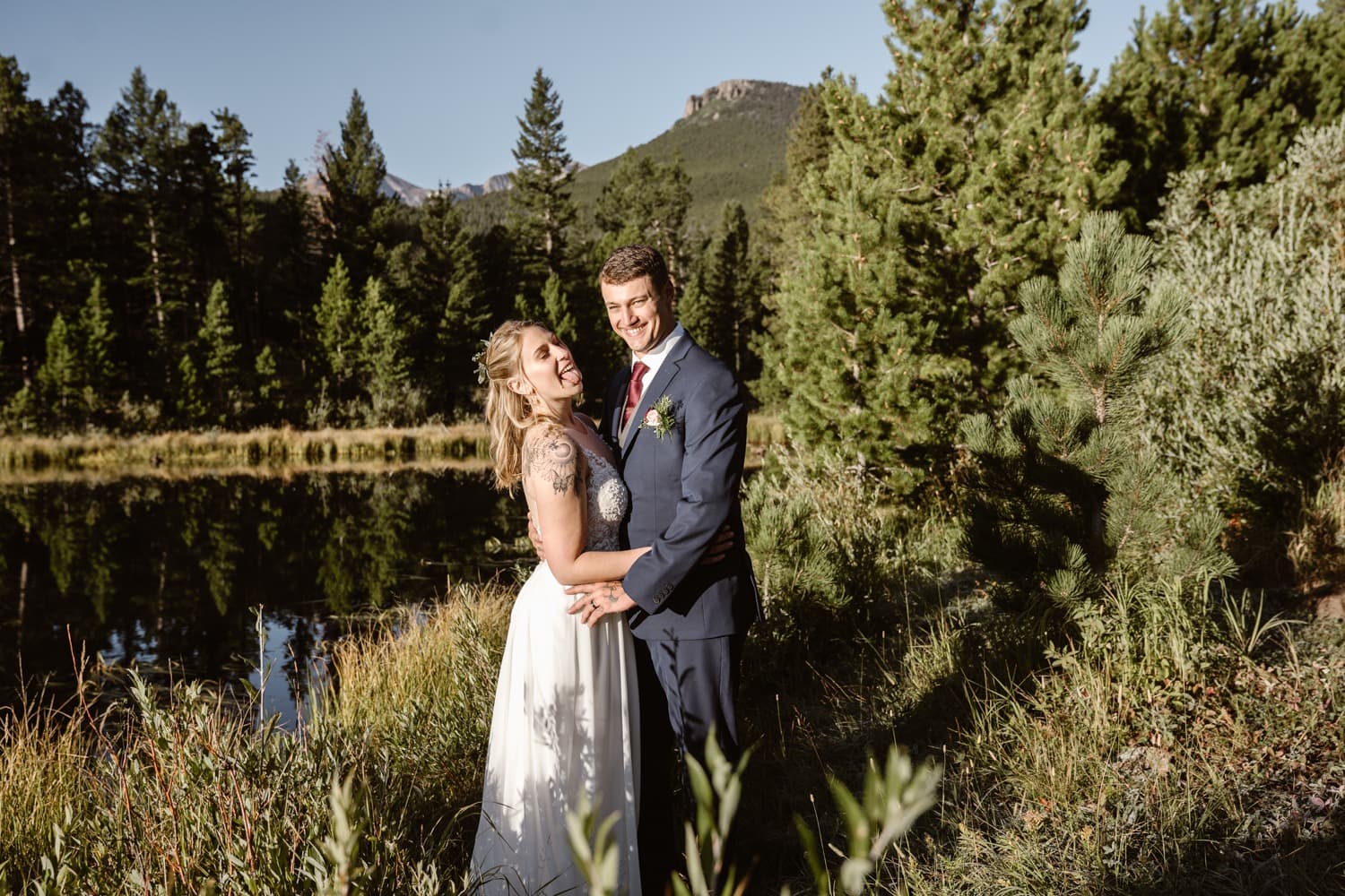 Bride and Groom laughing at Lily Lake Rocky Mountain National Park Elopement