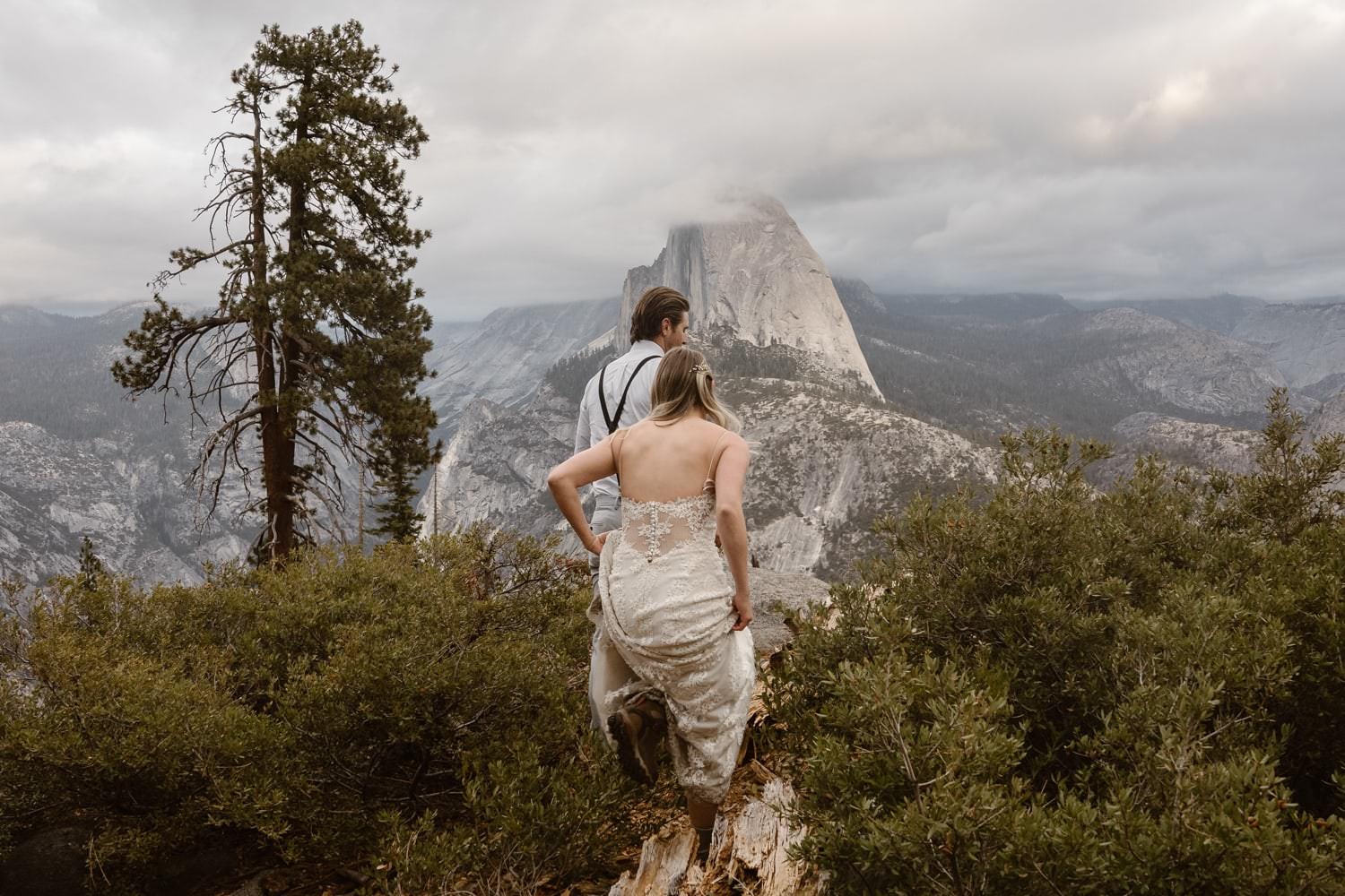 Bride and Groom Hiking at Glacier Point Yosemite Elopement