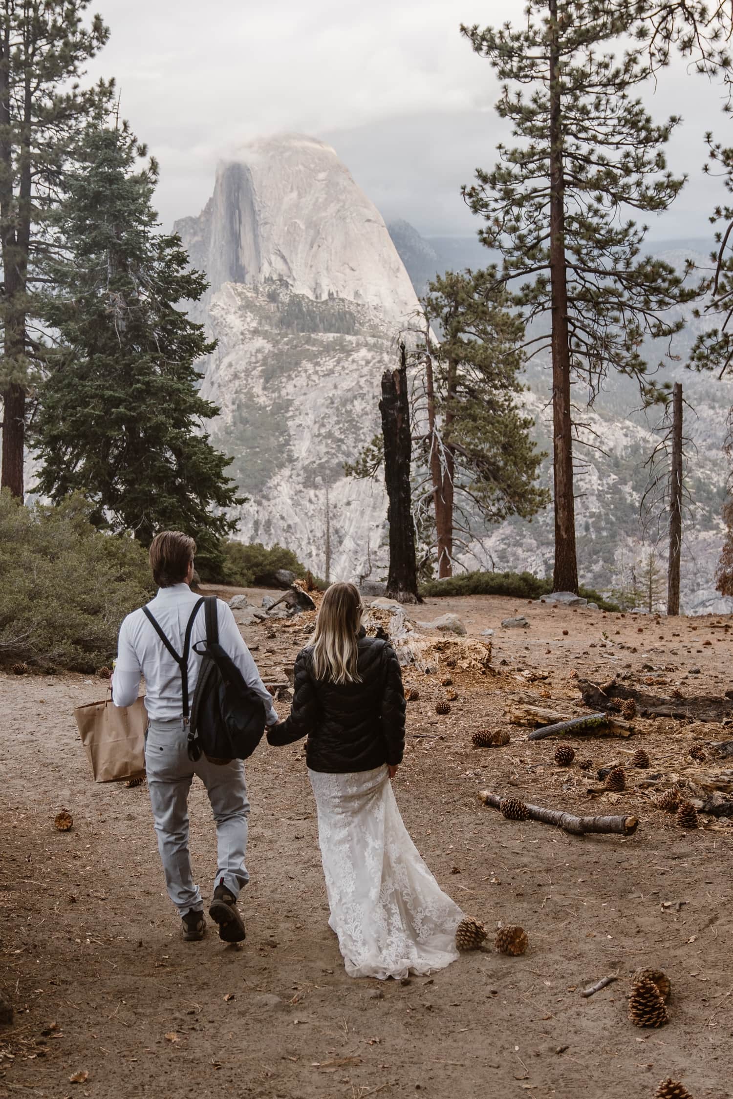 Bride and Groom Hiking at Glacier Point Yosemite Elopement