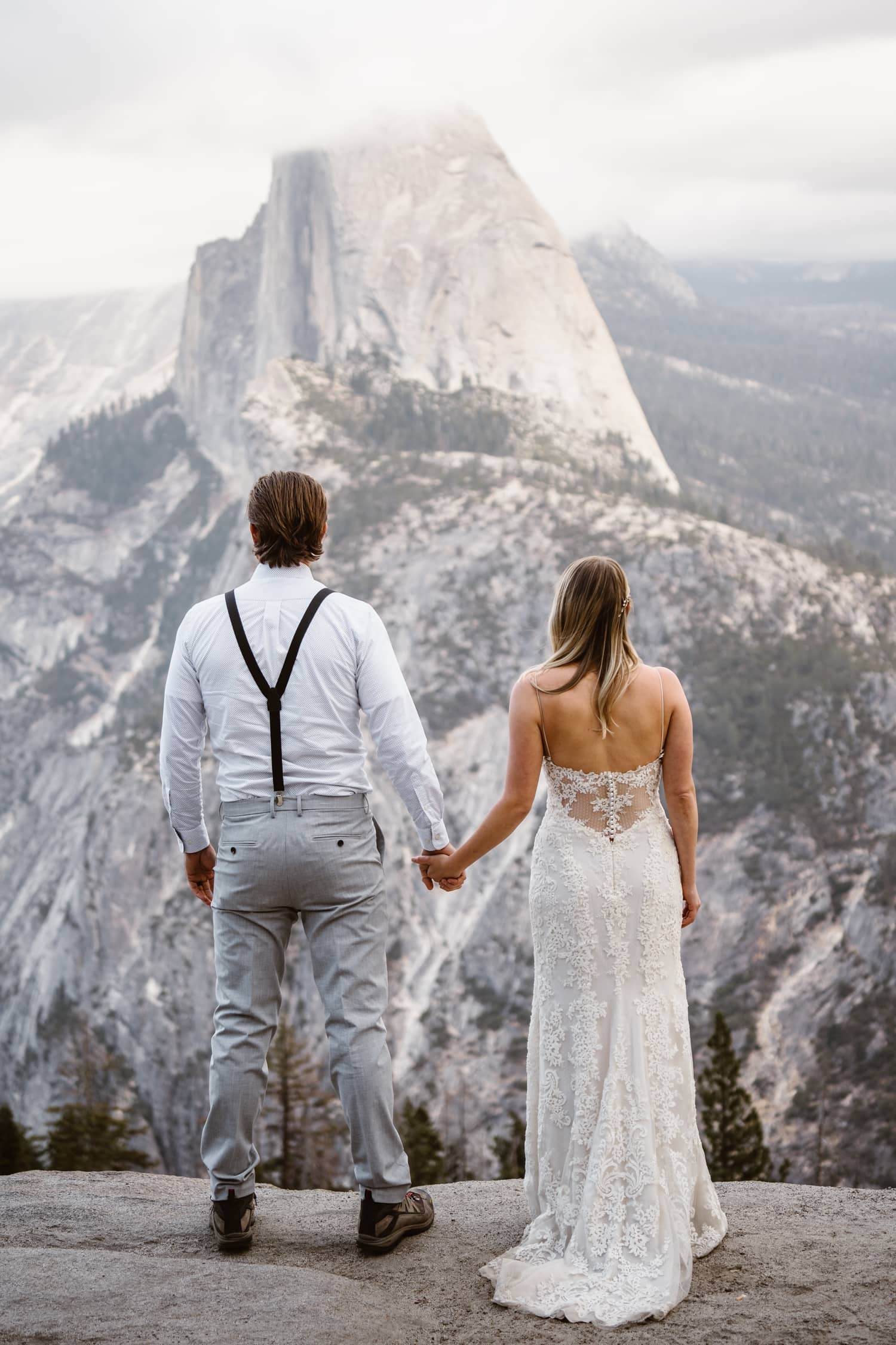 Bride and Groom Holding Hands at Glacier Point Yosemite Elopement