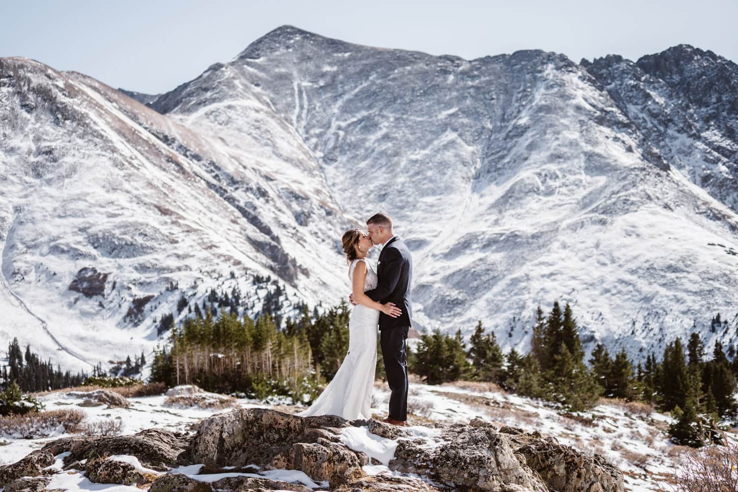 A couple kissing in the snow at Loveland Pass in Colorado