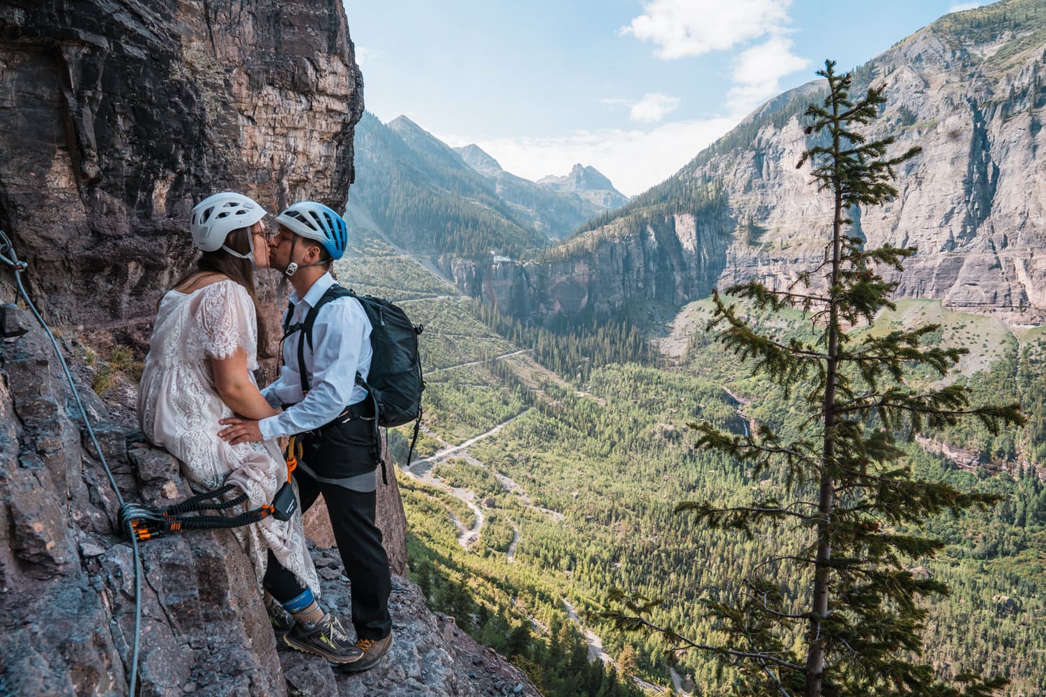 Couple rock climbing for their elopement activity.