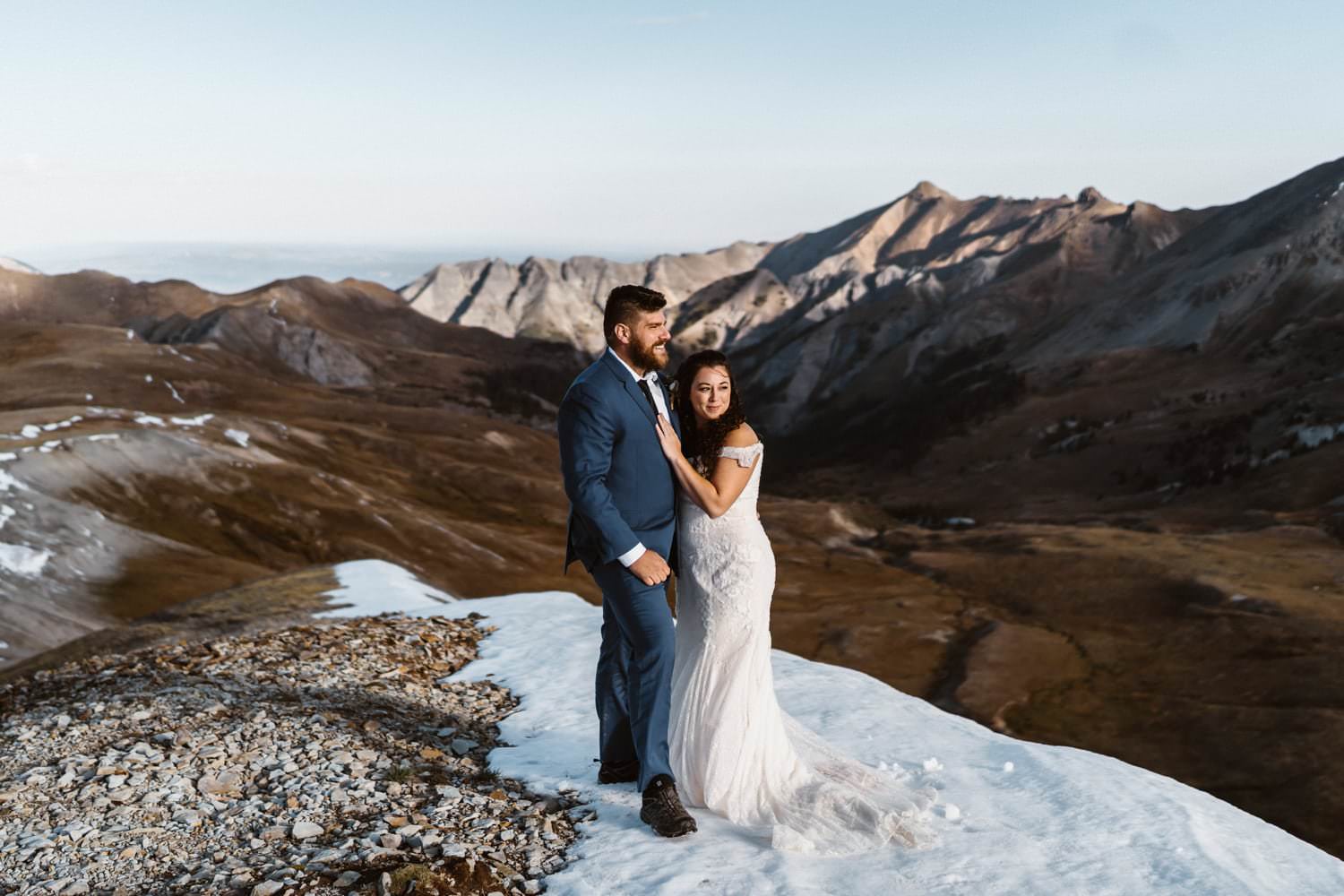 Bride and groom on a mountain for their jeeping elopement.