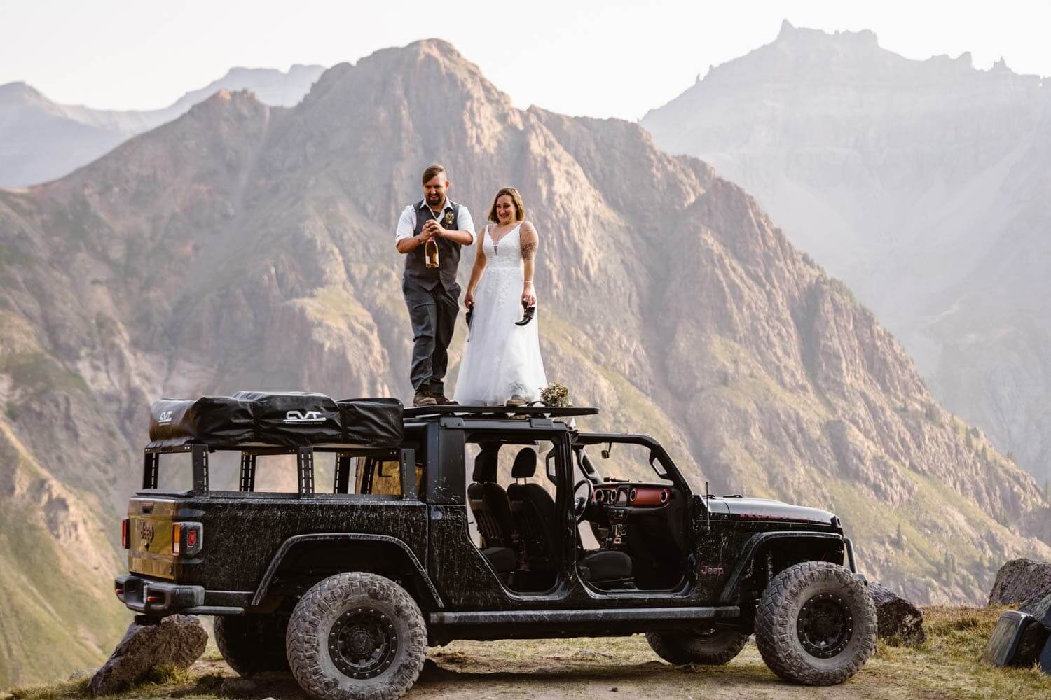 Bride and Groom Drinking Champagne Colorado Off-Roading Elopement