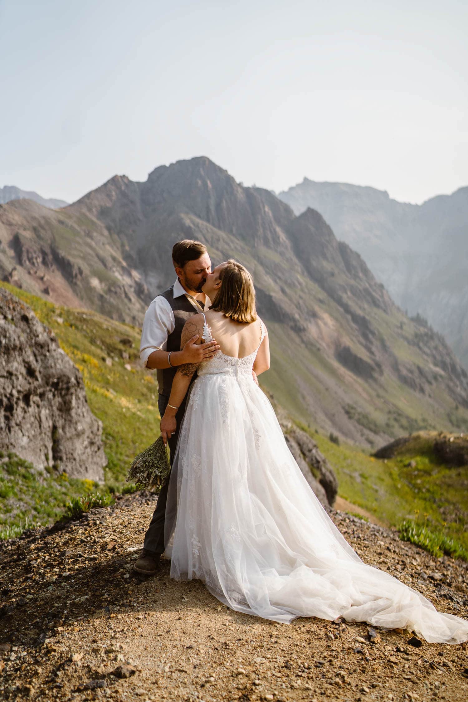 Bride and Groom Kissing Colorado Off-Roading Elopement