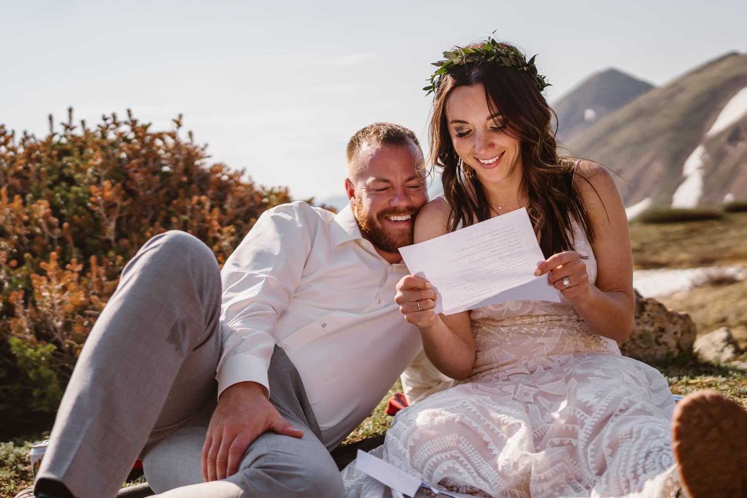 Bride and Groom Reading Letters at Sunrise Elopement in Colorado