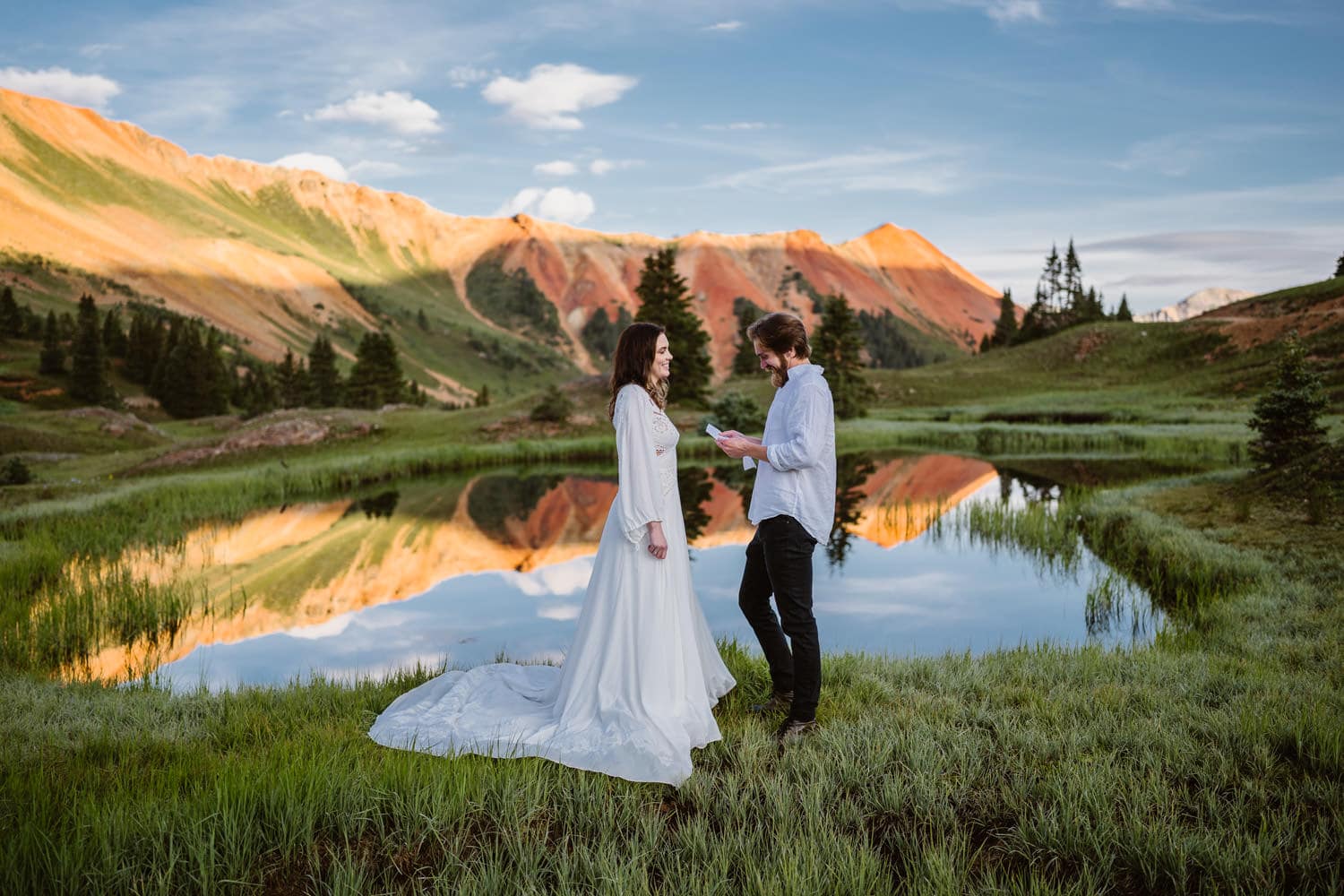 Sunrise vow ceremony with red mountains in the background