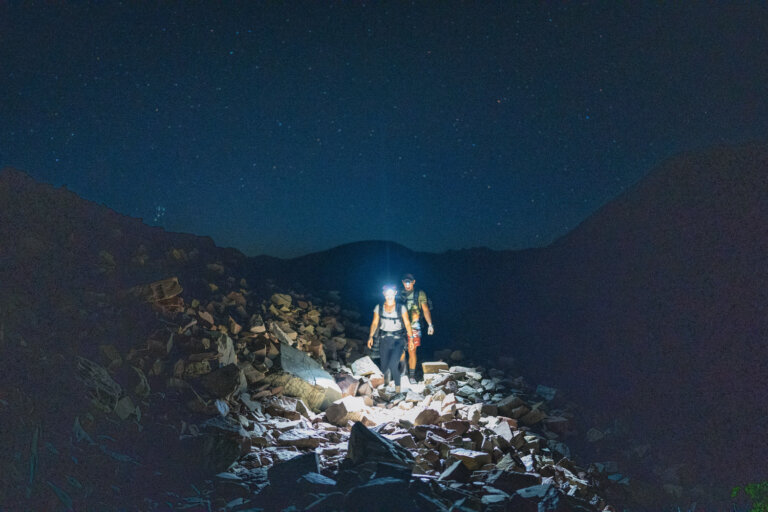 Couple hiking under their stars for their hiking elopement in Colorado.