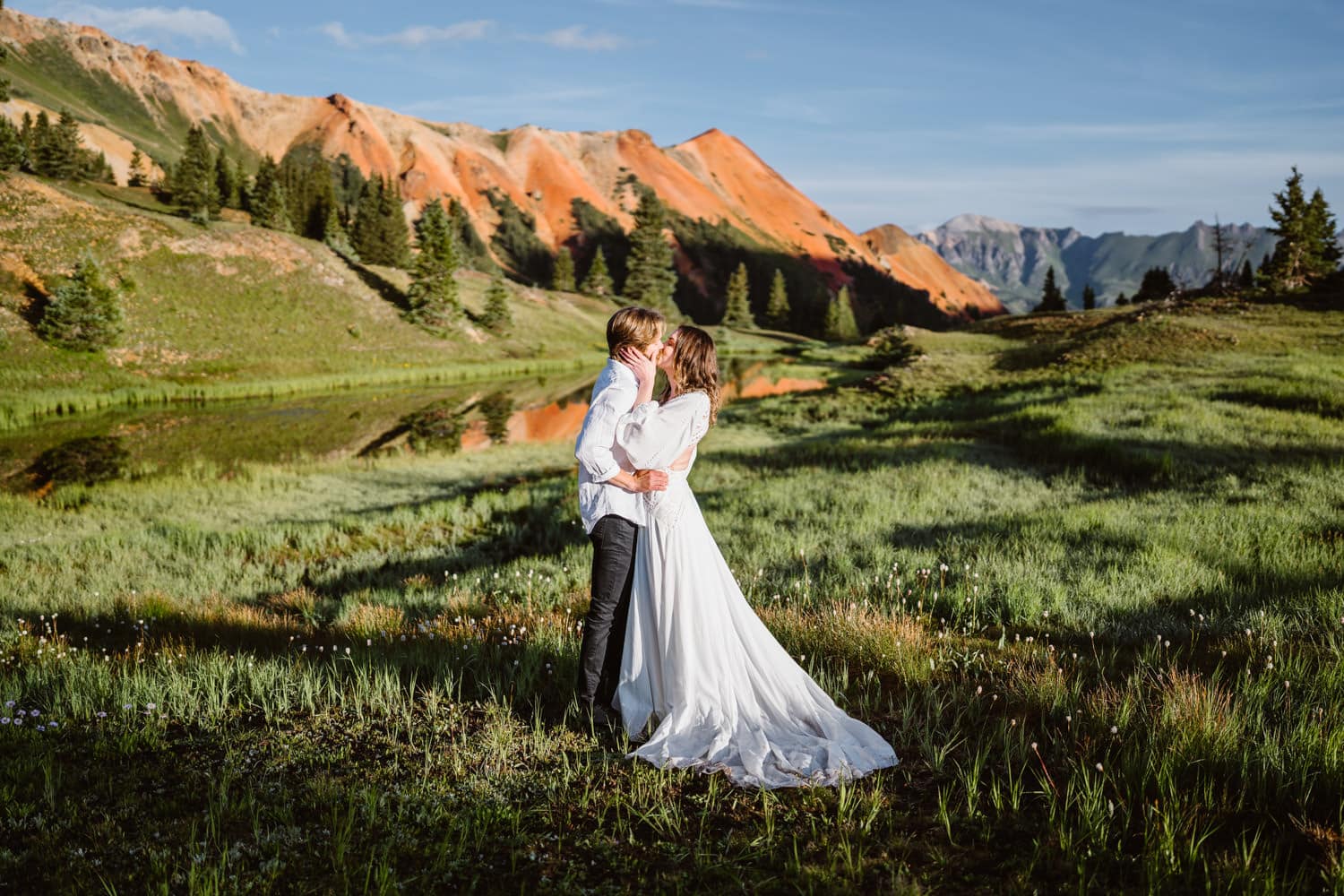 A couple sharing a kiss near Red Mountain Pass in Colorado.