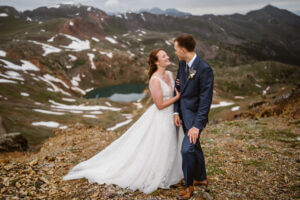 Bride and groom sharing a smile in the mountains of Colorado on their elopement.