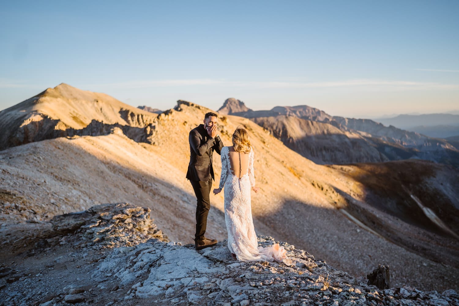 Couple sharing a first look on a mountain pass for their Telluride elopement.