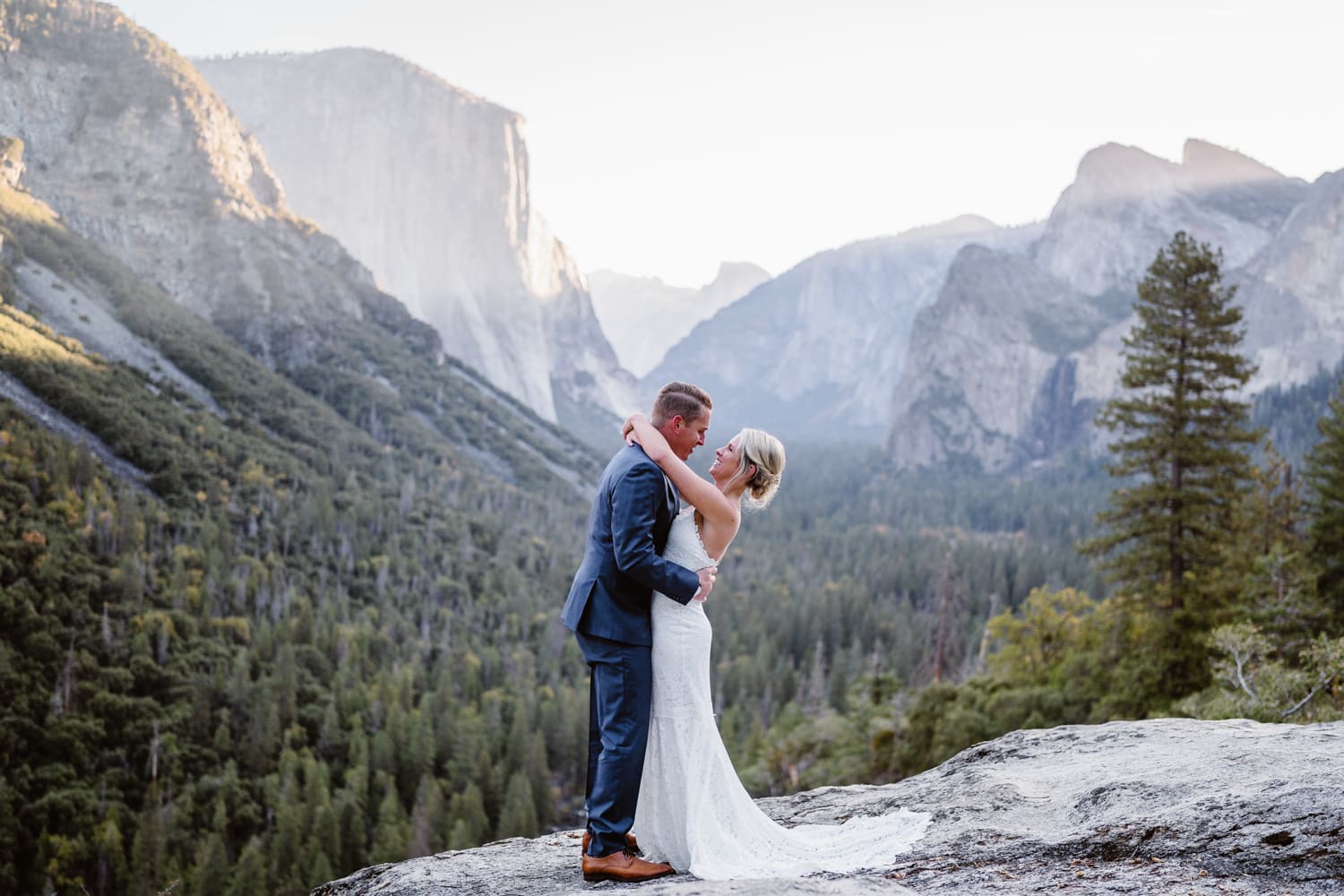 Bride and groom dancing at sunrise in Yosemite