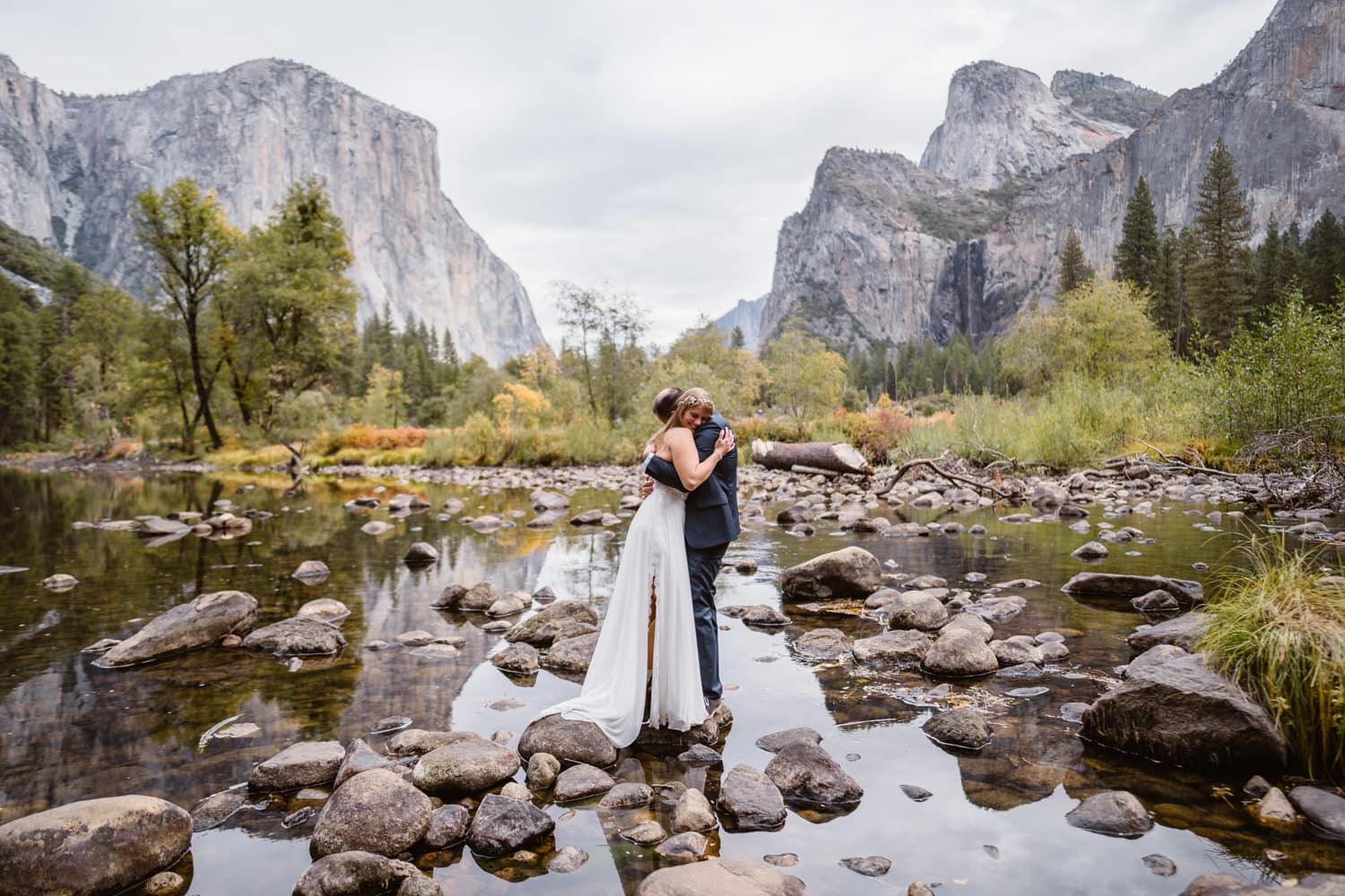 A couple hugging at Tunnel View in Yosemite National Park on their elopement morning.