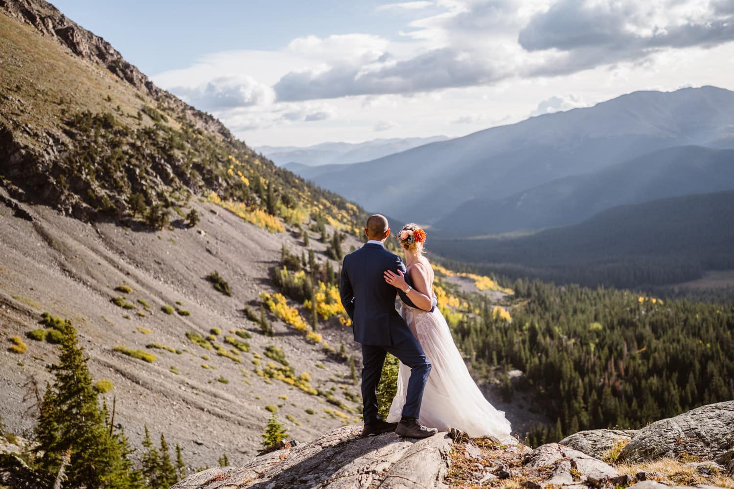 Bride and groom sharing the views of the fall colorado in Breckenridge, Colorado for their elopement.