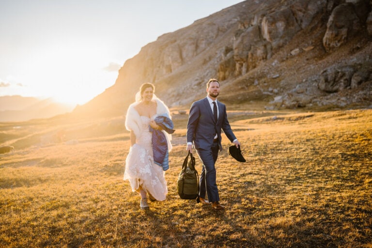 Couple hiking at sunrise for their hiking elopement in Colorado.