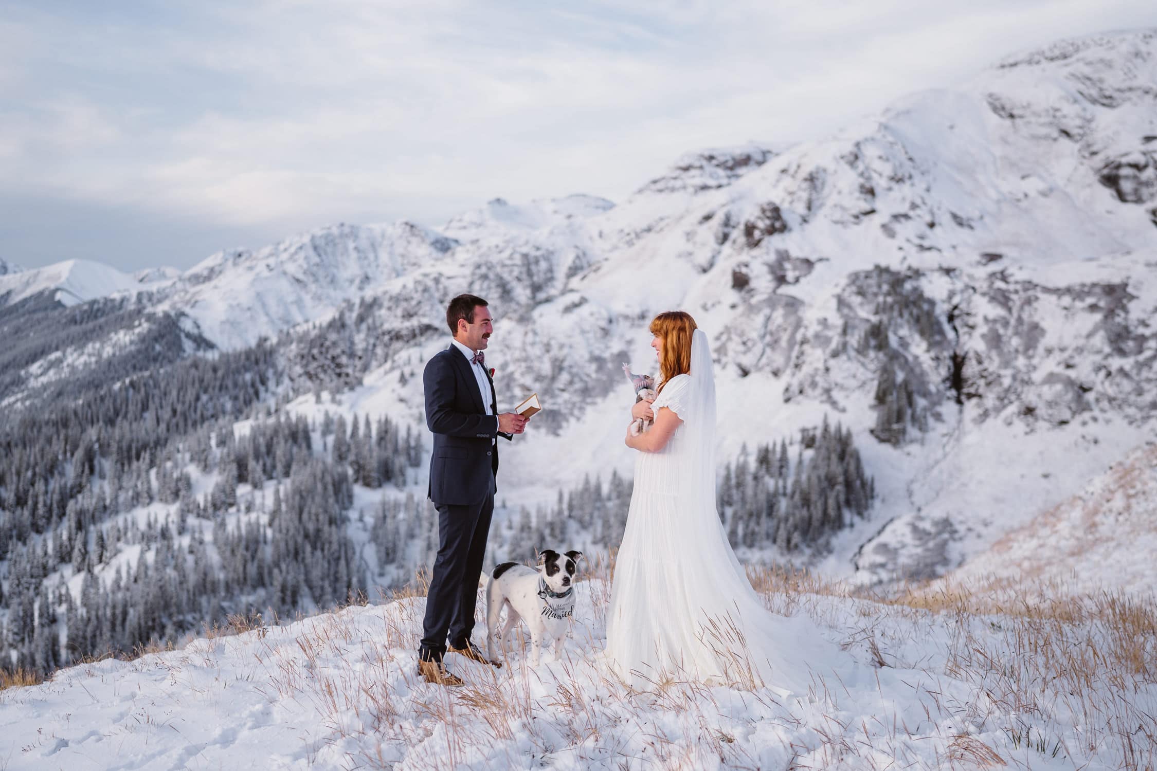 Bride and groom sharing their vows in the snow in Colorado for their elopement.