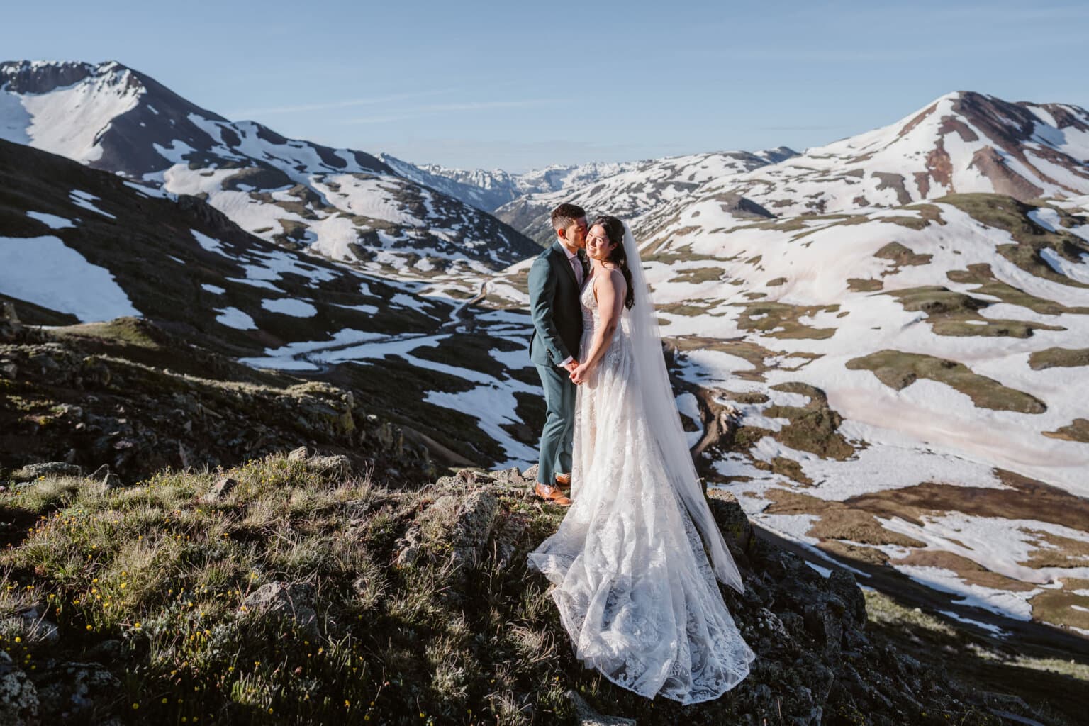 A couple sharing a kiss in the mountains of Colorado