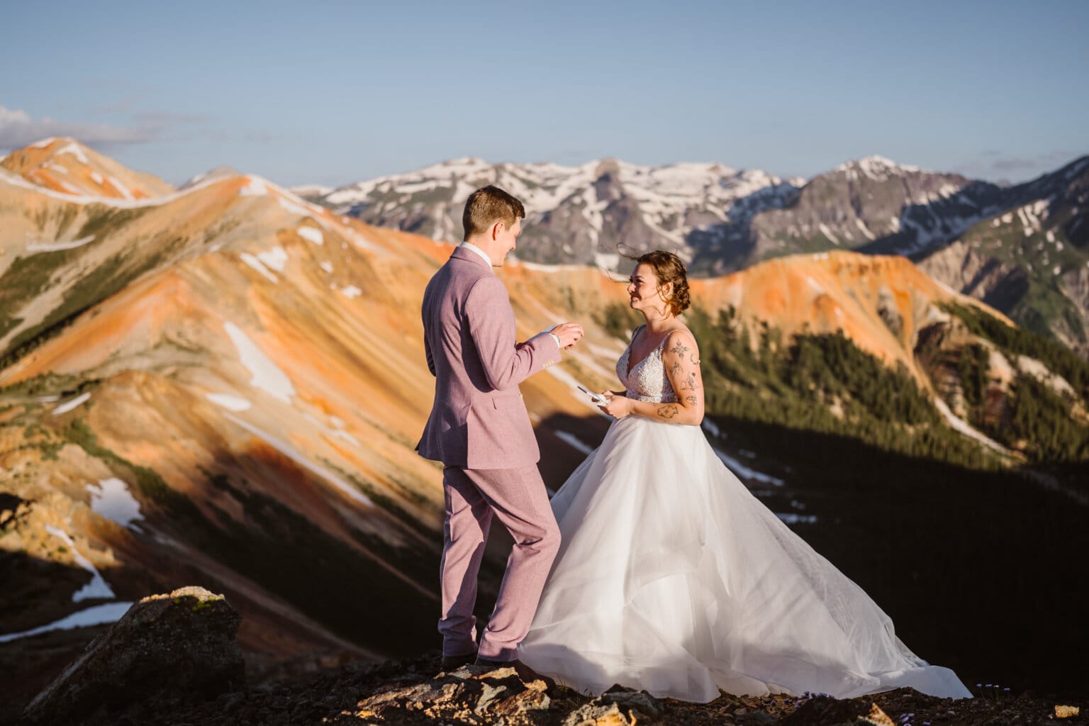A couple sharing their vows in the San Juan mountains for their Self-Solemnization elopement in Colorado.