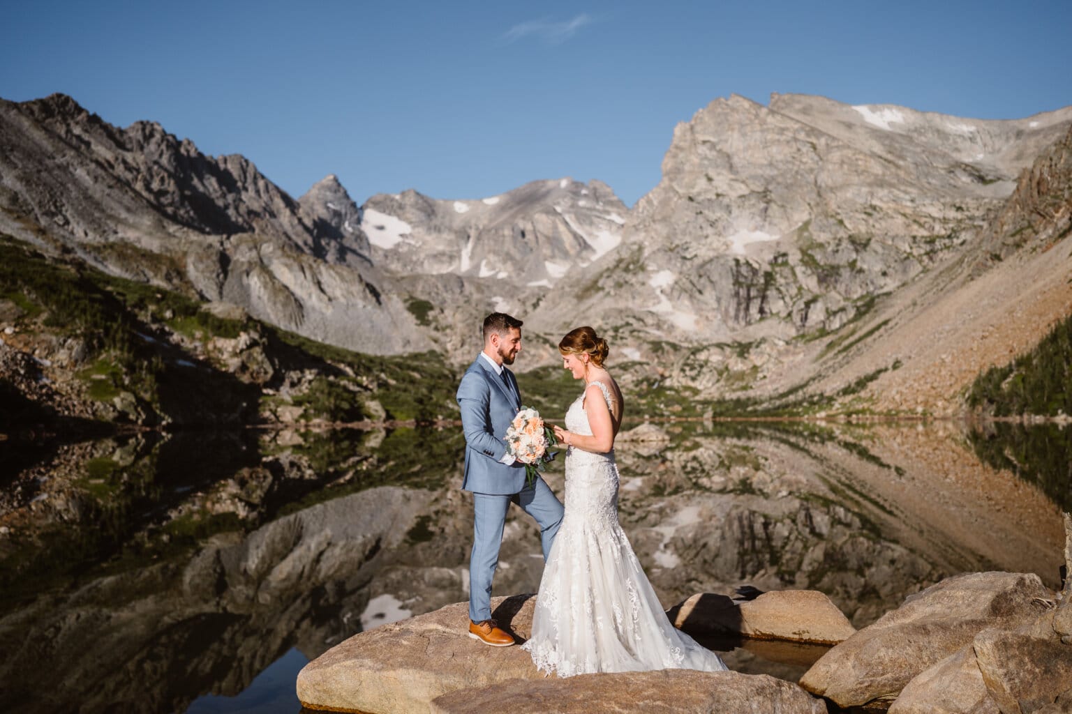 Couple sharing their vows near Lake Isabelle.