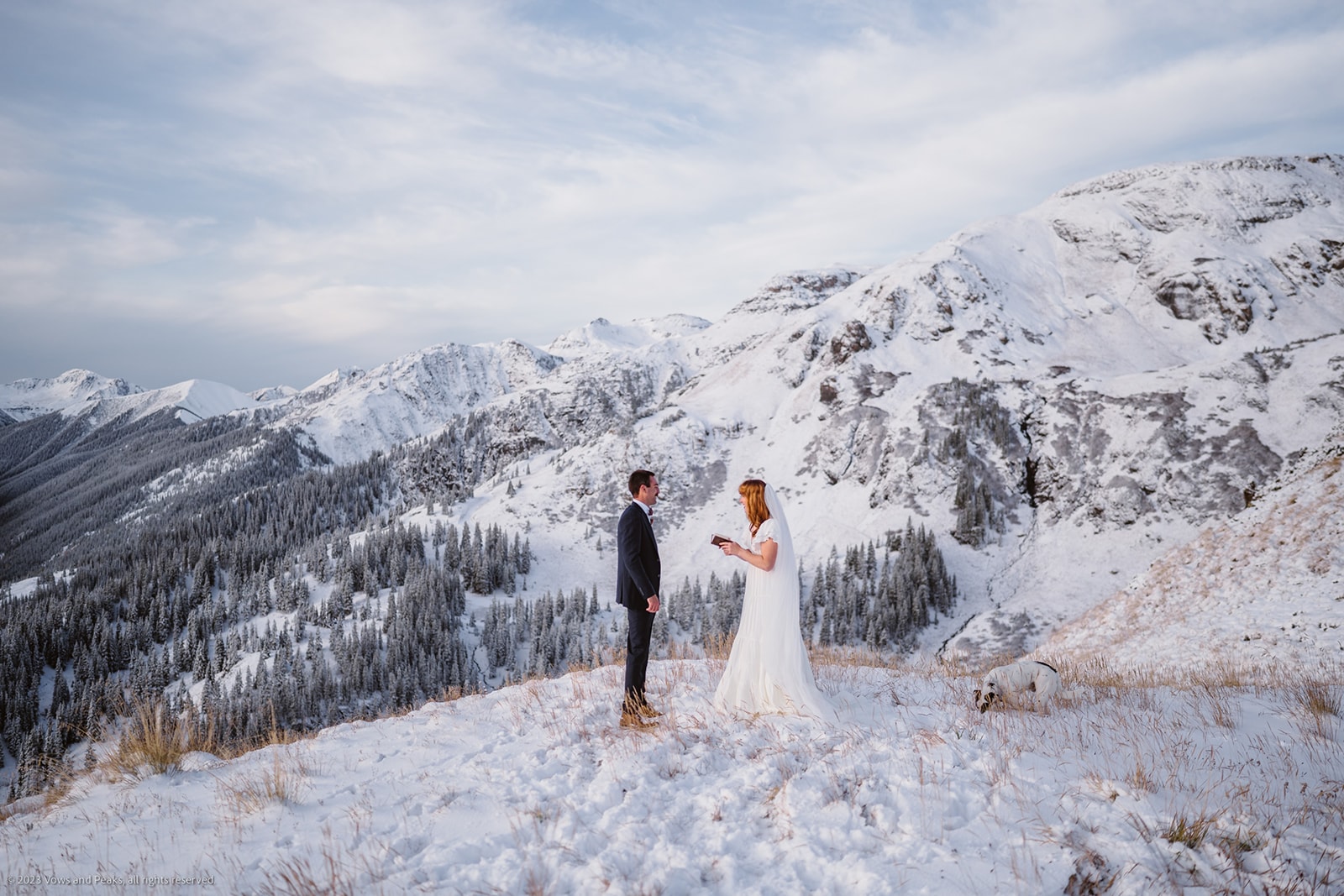 Couple sharing private vows at their self-solemnization in Colorado.