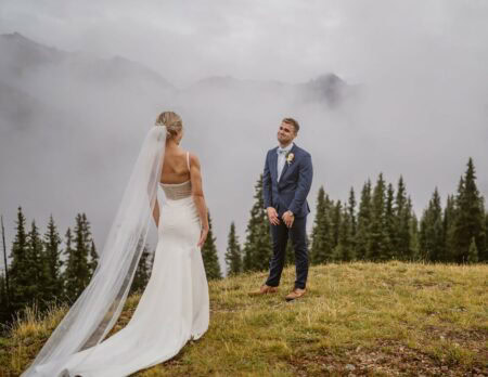 Couple sharing a first look at their Colorado elopement.