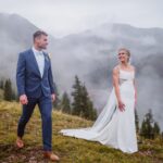 Bride and groom sharing a first look with the moody clouds in Colorado.