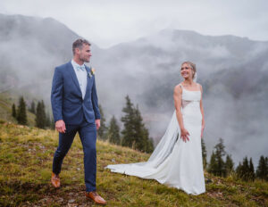 Bride and groom sharing a first look with the moody clouds in Colorado.