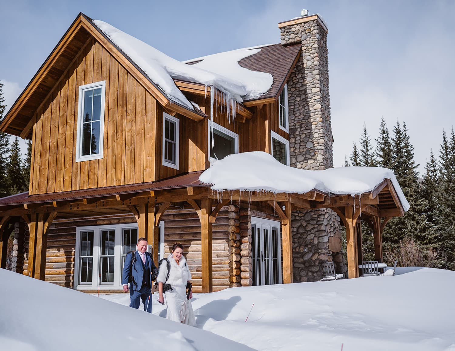 A couple leaving their cabin as they set off for their winter elopement in Colorado.