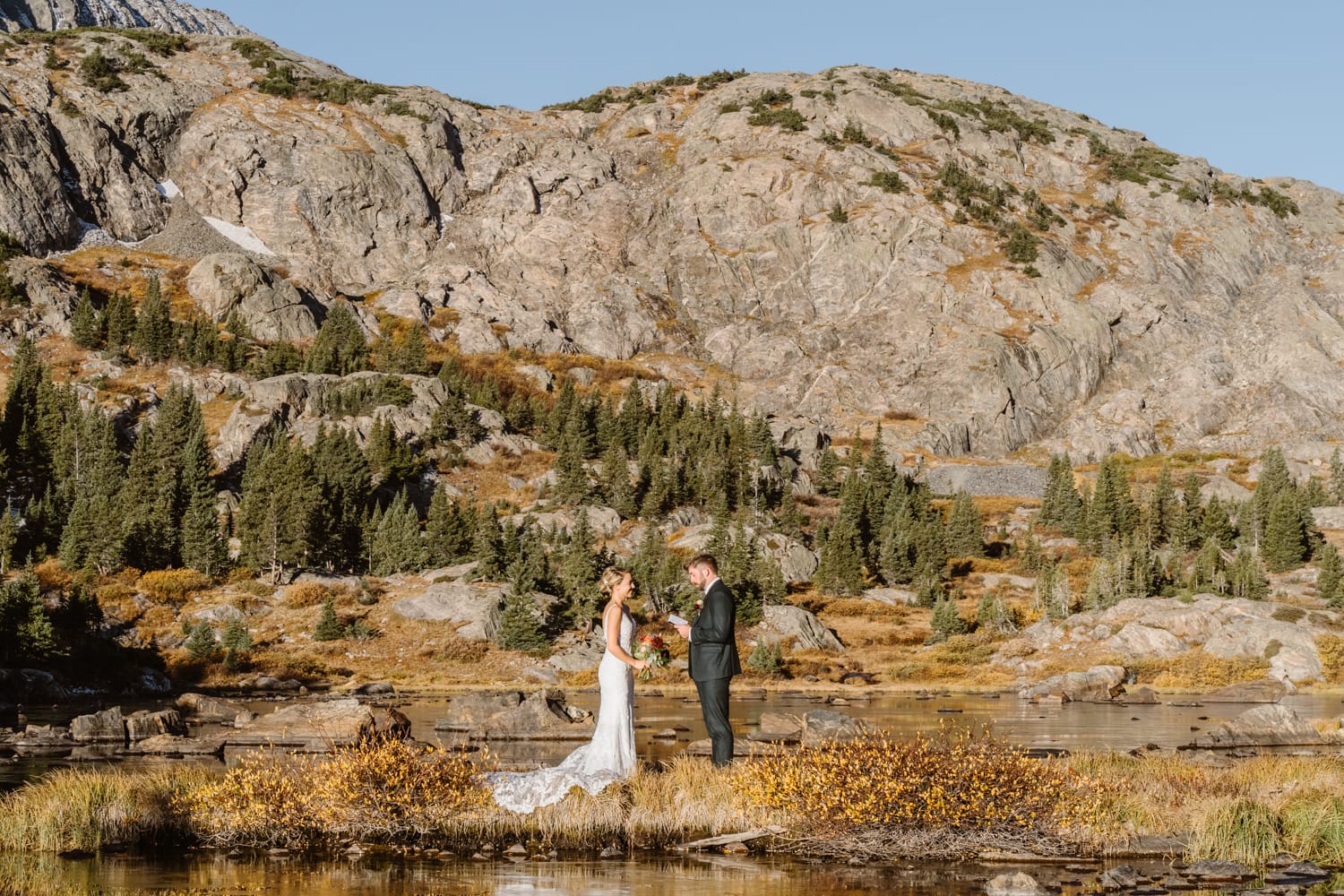 Kelsey and Eric sharing their vows at their Breckenridge elopement.