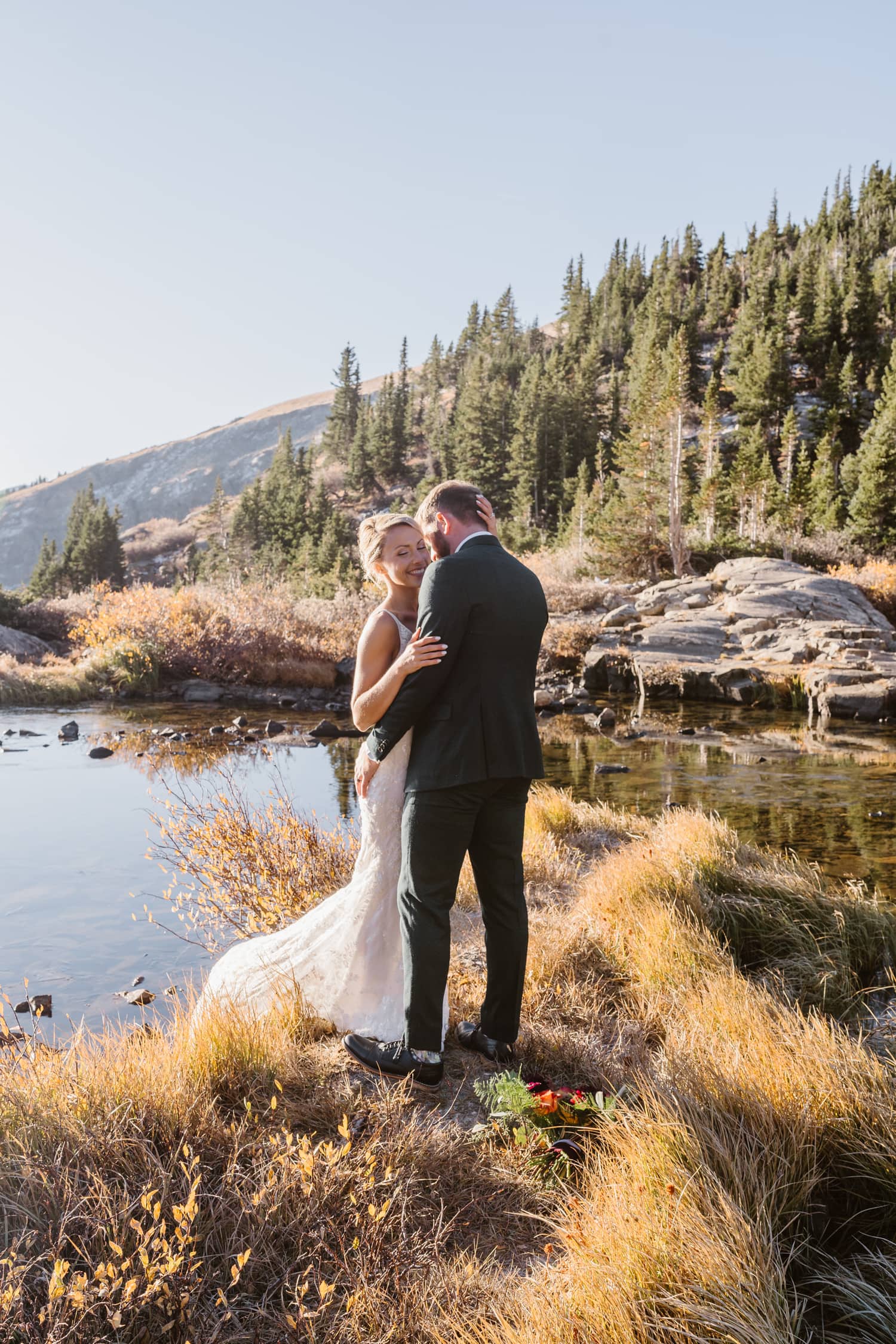Couple having intimate moment at their Breckenridge elopement.